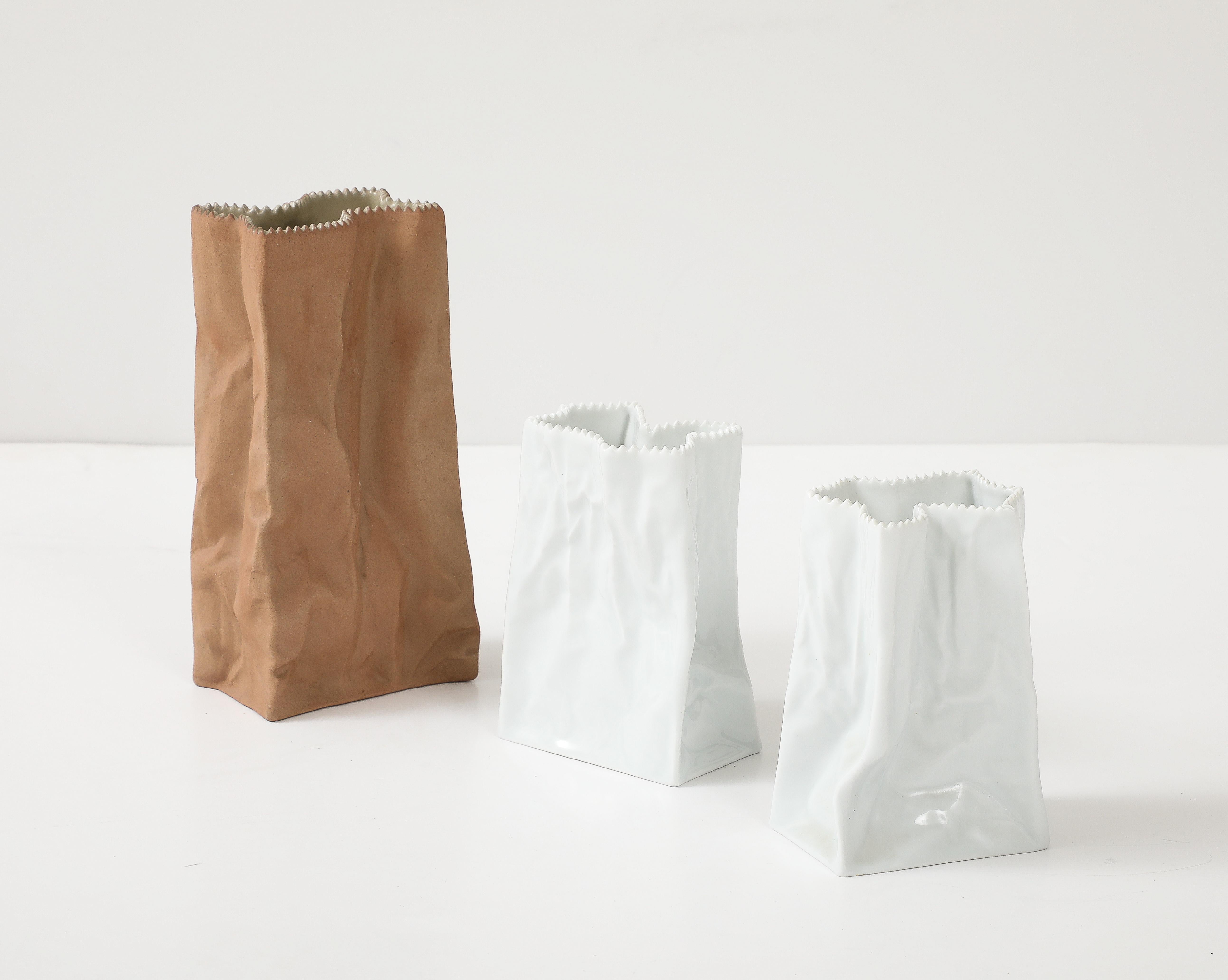 Set of 3 iconic Mid Century porcelain paper bag vases designed by Tapio Wirkkala for Rorenthal. Each vase is stamped on bottom.