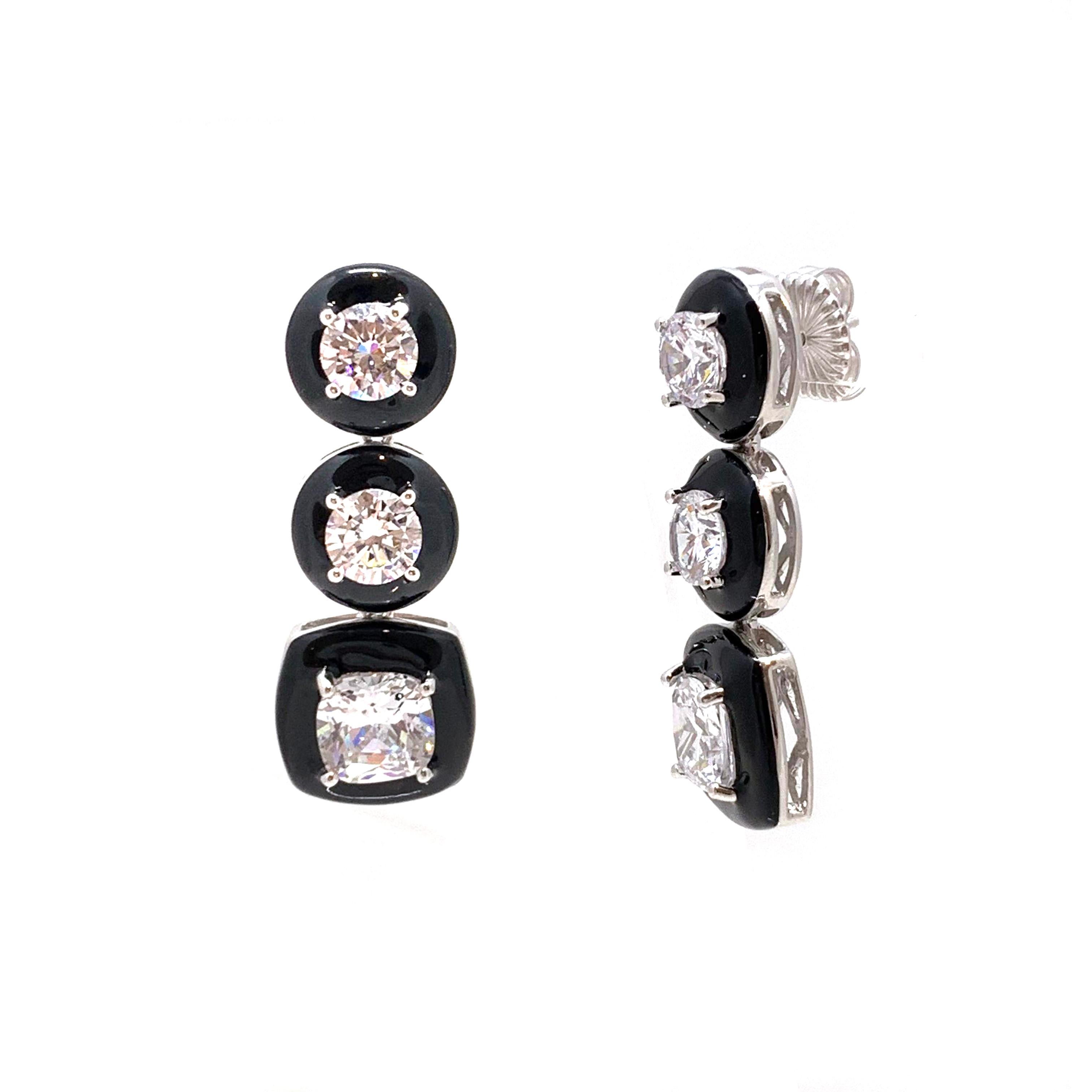 Elegant 3-Tier Black Enamel Simulated Diamond Dangle Sterling Silver Earrings

These modern-style earrings feature round and cushion-cut simulated diamond cz (5ct total each side) handset in platinum rhodium plated sterling silver and layered over