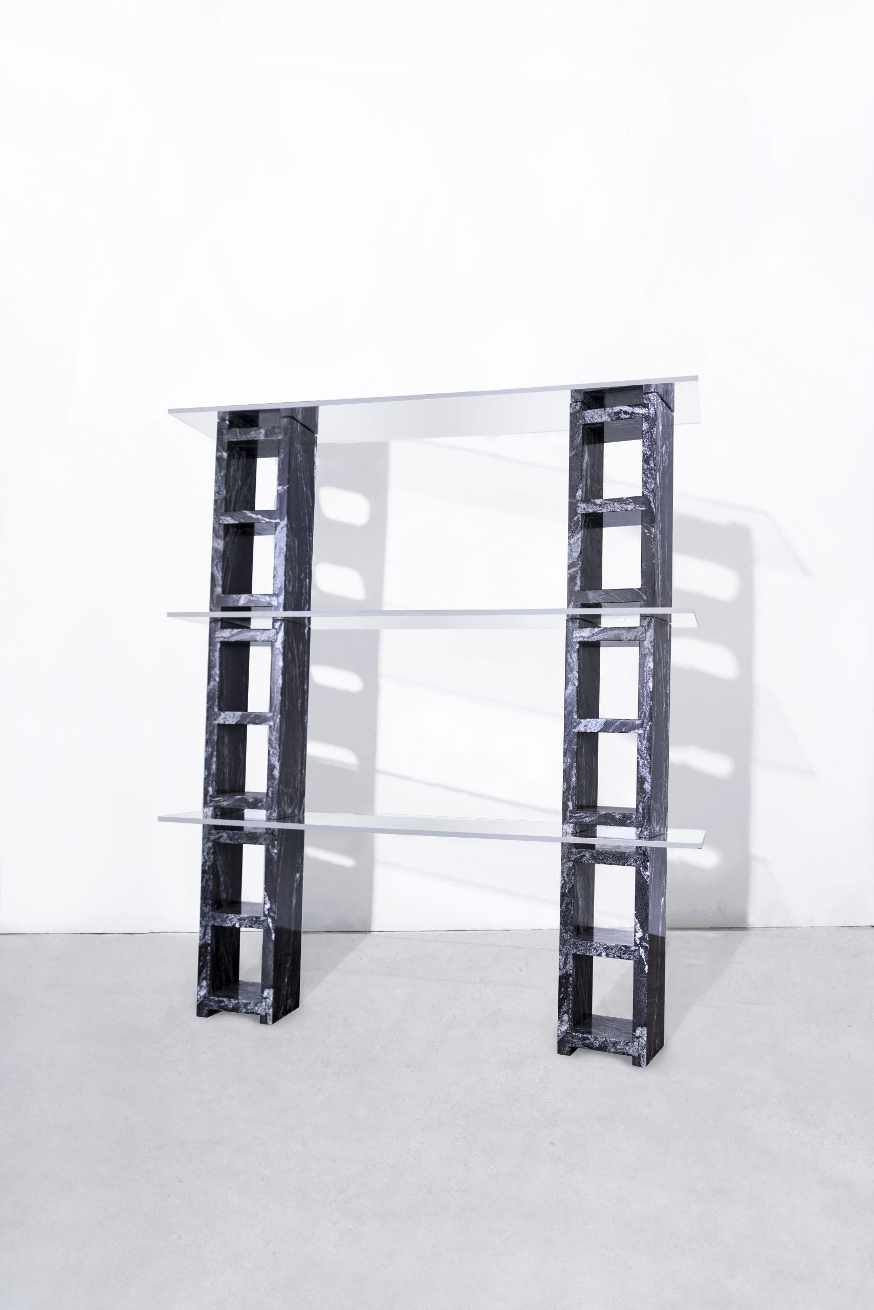 Description
6 water jet cut, hand-polished nero marquina marble blocks, supporting 3 tempered glass shelves.
Starphire glass shelves.
Modular.
Made to order in nyc.

Dimensions
Cinder block length 18.75?
Cinder block width 7.5” 
Cinder
