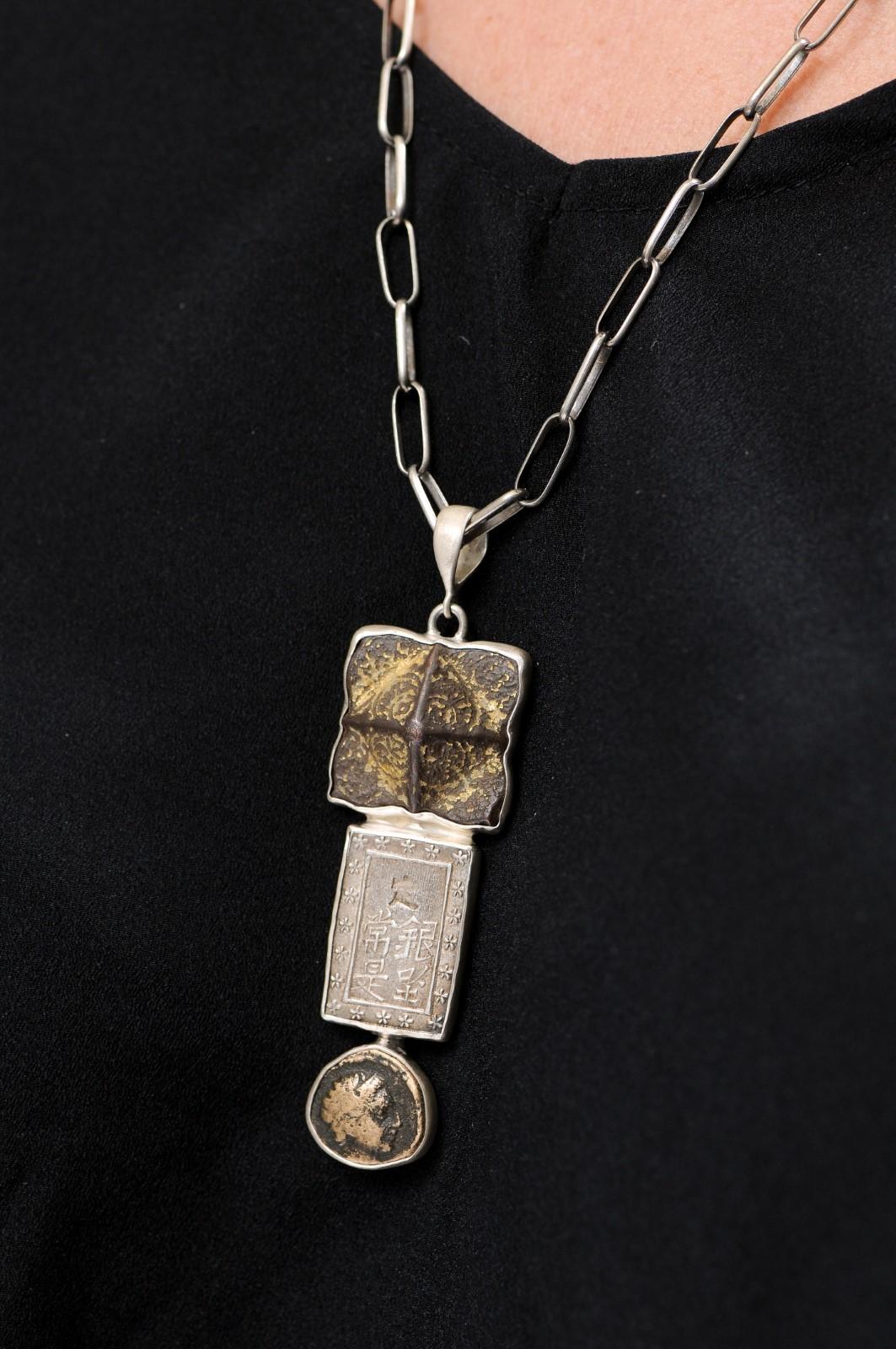A three-tired drop pendant of mixed ancient artifacts and coin set in sterling silver, with a hand-made Native American Indian sterling silver chain. This artisan-crafted piece is comprised of a Roman era artifact at top, with 1 Bu (Ichibu) Japanese