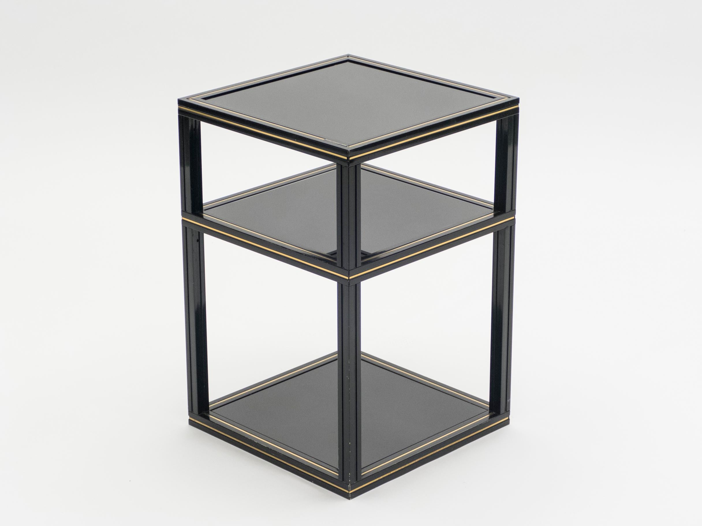 This stately black metal and brass Pierre Vandel side table or pedestal is an elegant Hollywood Regency piece on which to display your vase, lamp, or decorative statue. This 3-tiers black opaline glass table is a simple way to add a dash of 1970s