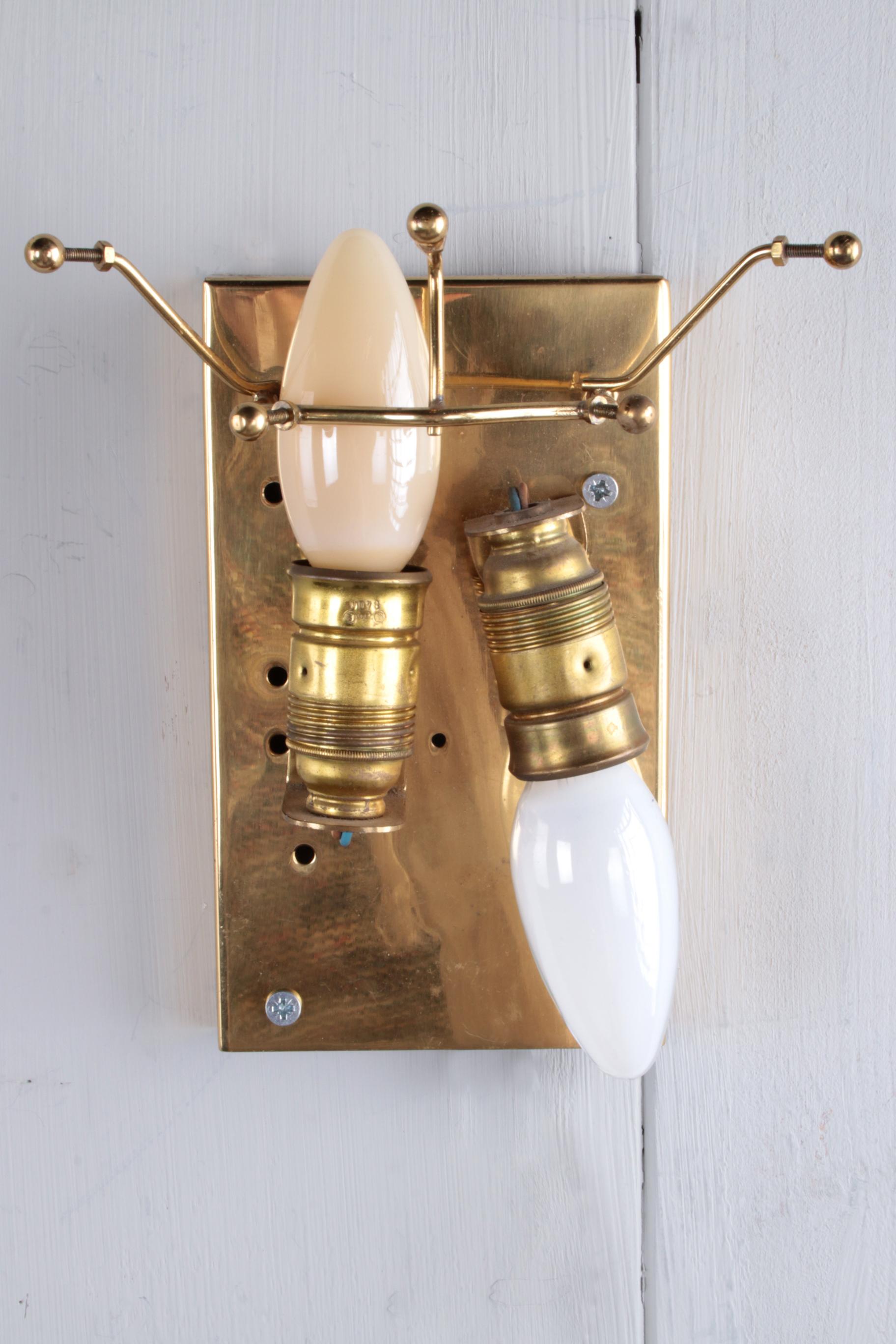 Beautiful and elegant modern brass wall lamps or sconces, 

manufactured by J.T. Kalmar in Austria around the 1960s.

Stylish design, executed to a very high standard. Five solid glass chains dangle from each wall lamp.

The clean lines in the