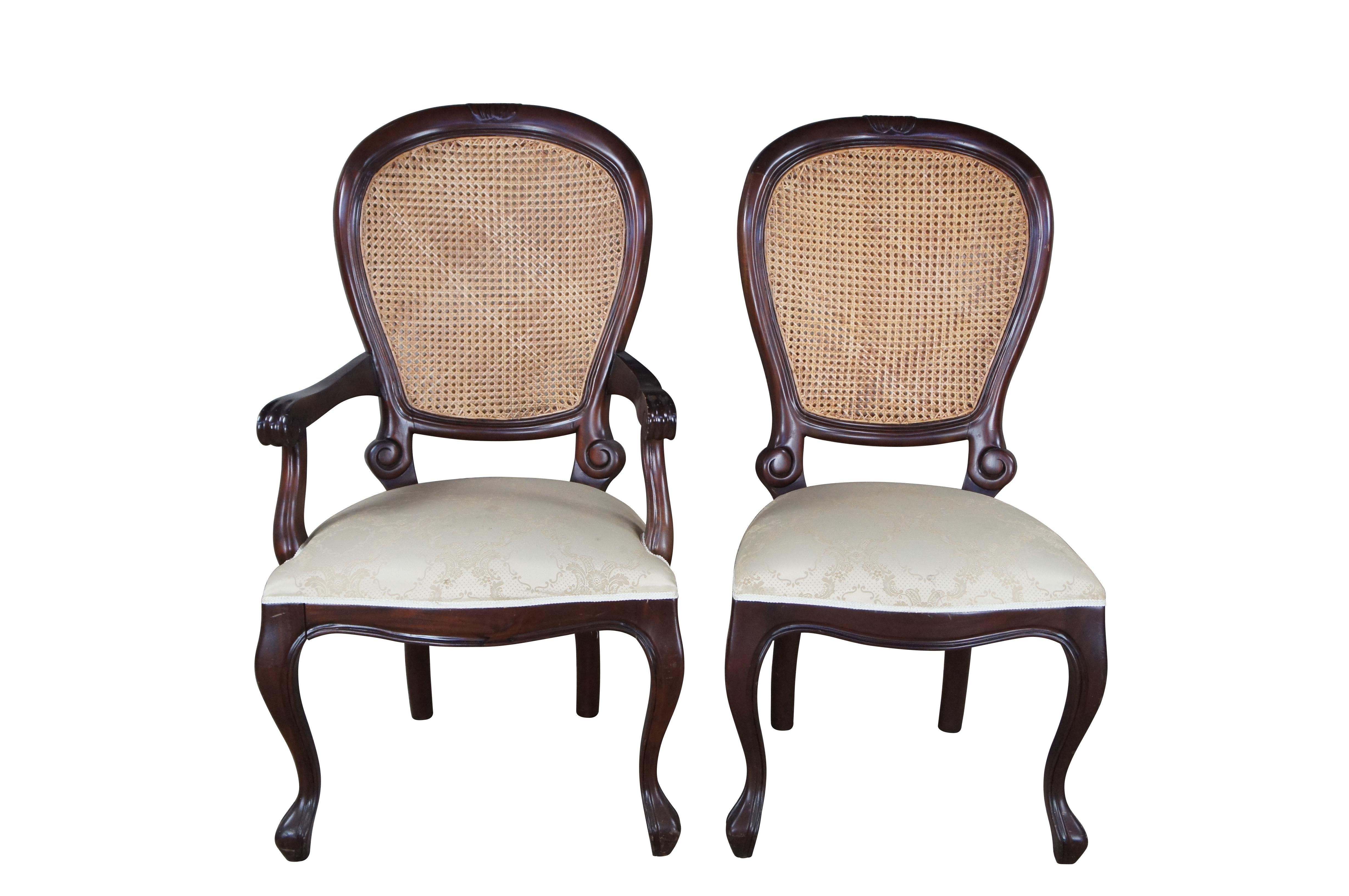 Set of 3 large late 20th century Victorian style dining chair. Made for Due Process Trading Company. Feature a solid mahogany frame with double cane balloon or spoon back leading to scrolled accents and silk brocade seat cushions. The chairs are