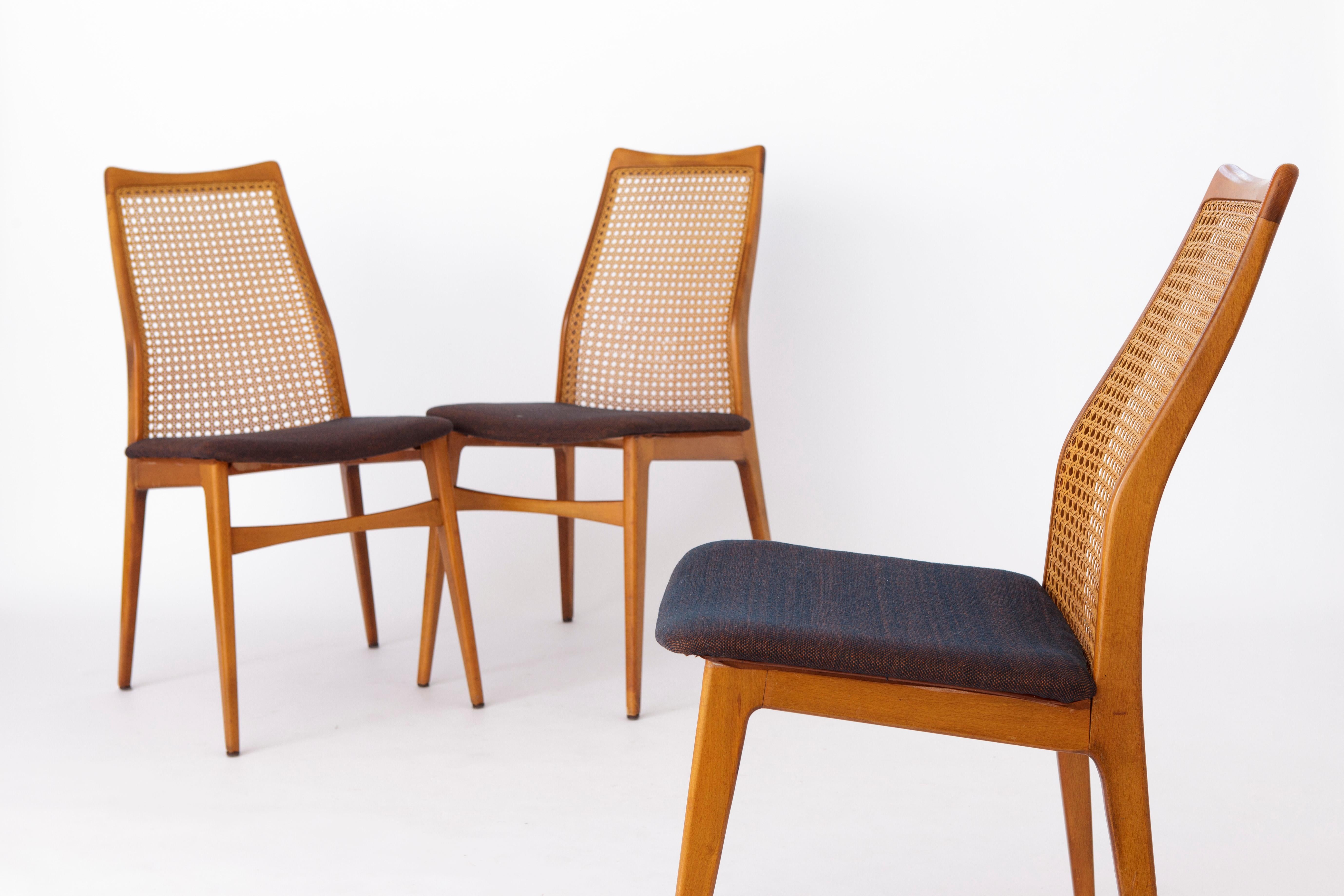 Set of 3 Vintage Chairs by German manufacturer Wilhelm Benze.
Production period: 1960s. 
Displayed price is for 2 chairs. 

Good vintage condition. Dyed beech wood chair frames. 
Seats are reupholstered. 
The seats are glued and not screwed.
In
