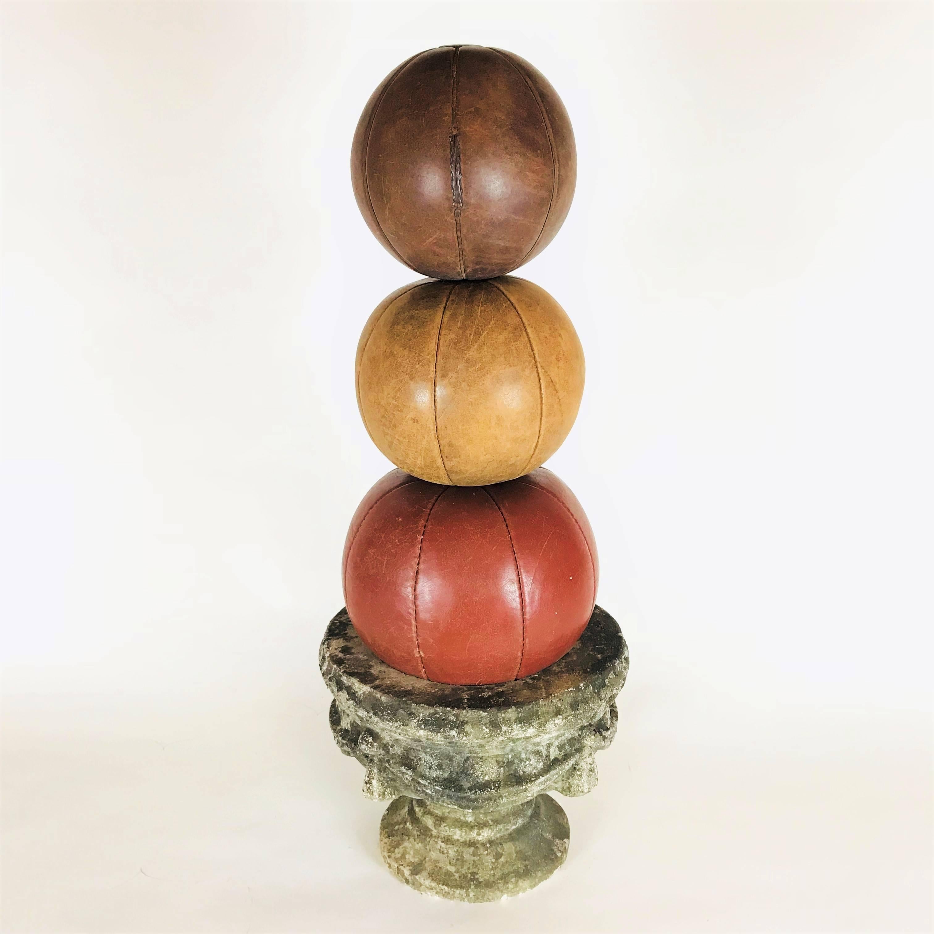 The medicine balls are part of a big collection from the 1920s-1930s, the time of the first gym enthusiasts in Europe. The balls are handmade, in a very good condition with nice patina and an intense color. 

Diameter: 23, 24, 28 cm / 9, 9.5, 11 in.