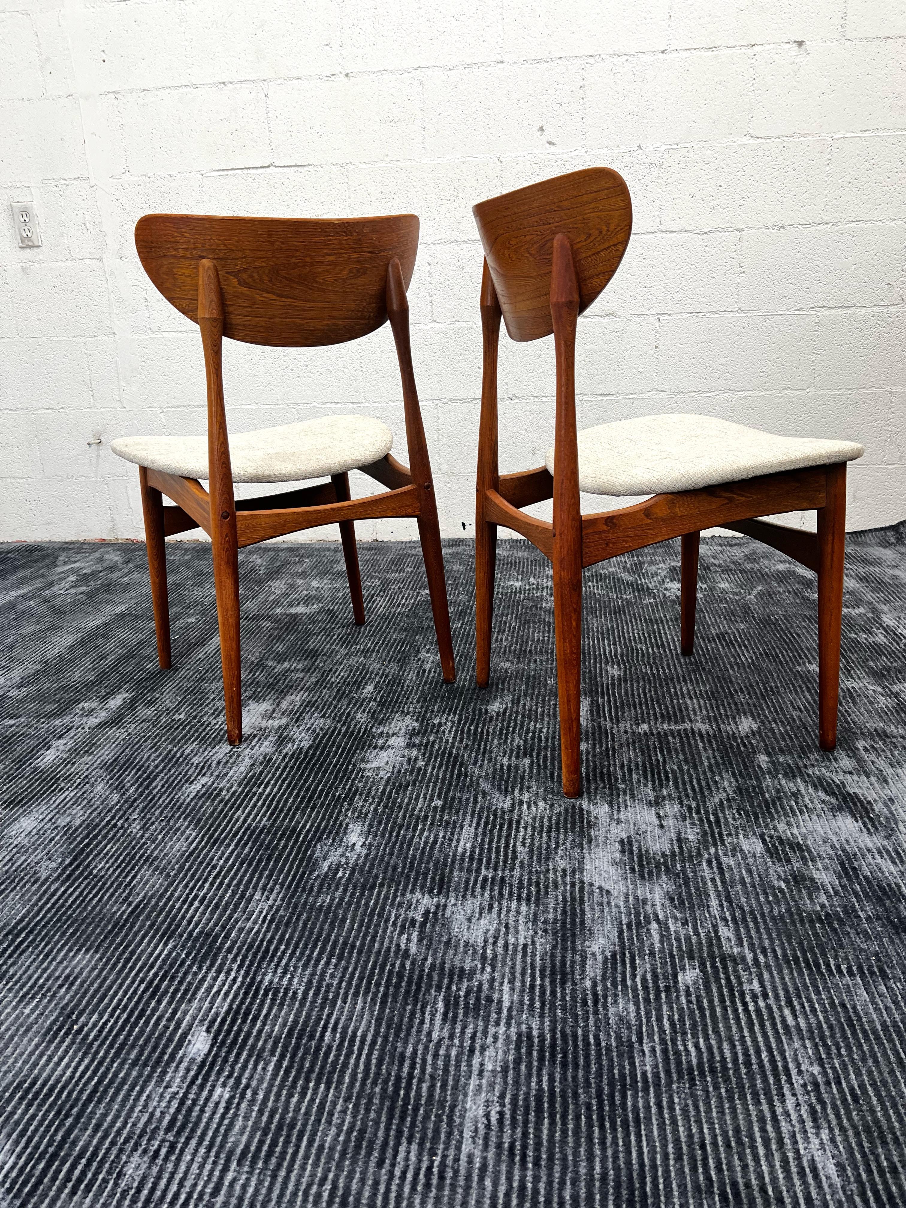 Solid teak dining chairs by the iconic Virtue Brothers of California. 
Newly upholstered with fabric by knoll, “Diva Moon” 
Set of three in In newly restored condition.