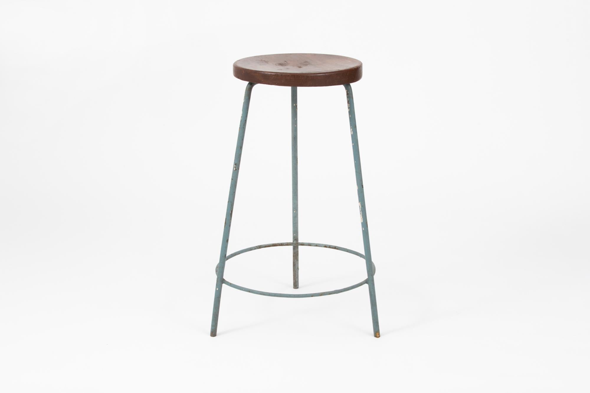 3 Original painted iron and teak stools designed by Pierre Jeanneret. These stools were created for the famous modernist capital city of Chandigarh, India that was designed by Le Corbusier, Jeanneret, and their team. Model number PJ-SI-57-A. The