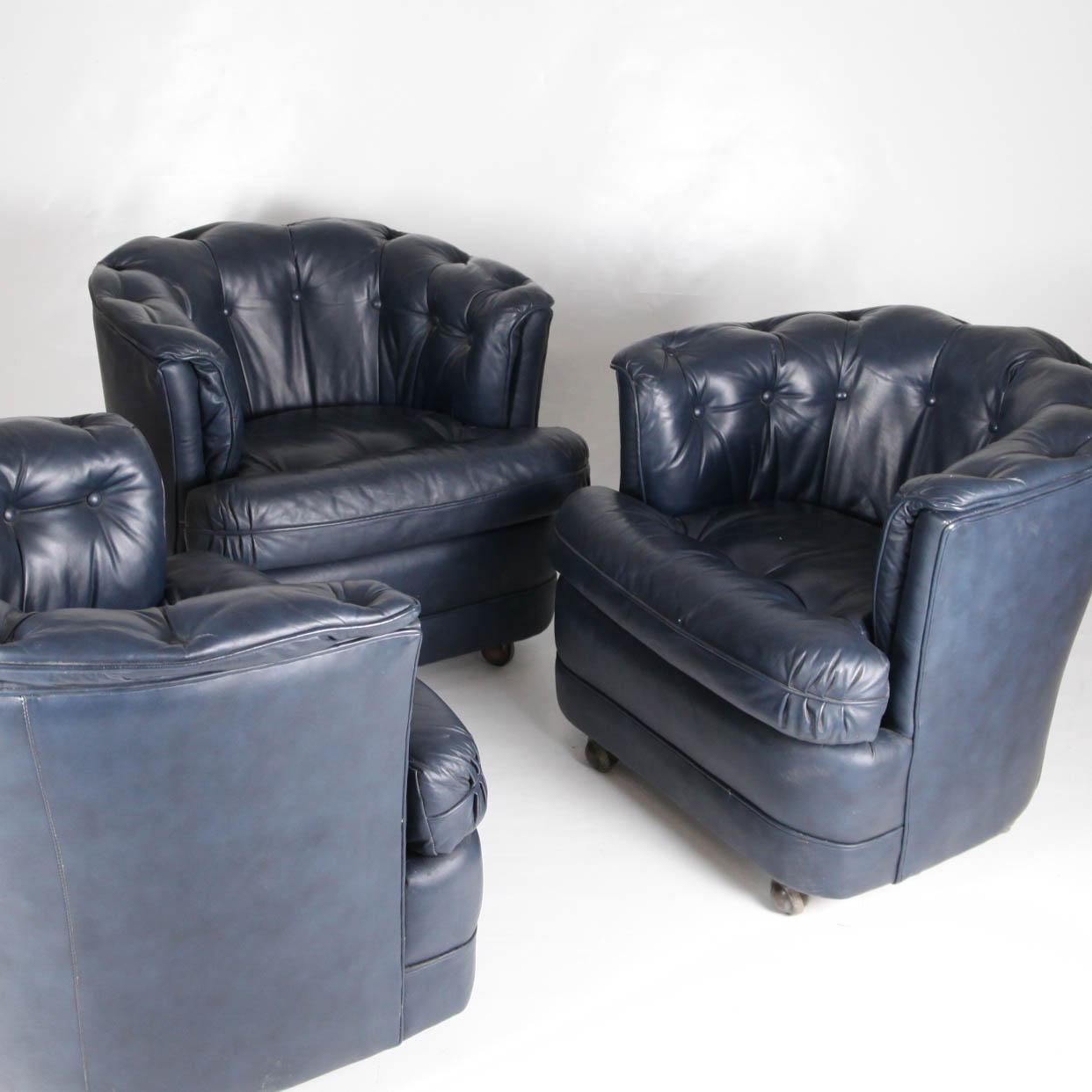 3 vintage small midnight blue leather armchairs with brass casters by Richard Plumer ciaca 1982. They are chic and comfortable. Surely inspired by Chesterfield chairs with different details. Unique design and color.