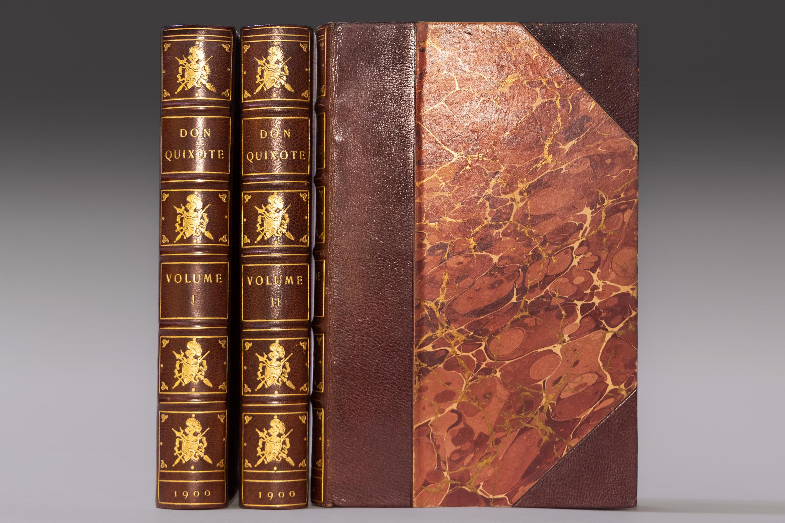 3 Volumes. Miguel De Cervantes, The History of the Valorous and Witty Knight-Errant Don Quixote of the Mancha. Bound in 3/4 wine morocco. Marbled boards. Raised bands. Gilt-tooled knight symbol on spine. Top edges gilt. Marbled endpapers. Published:
