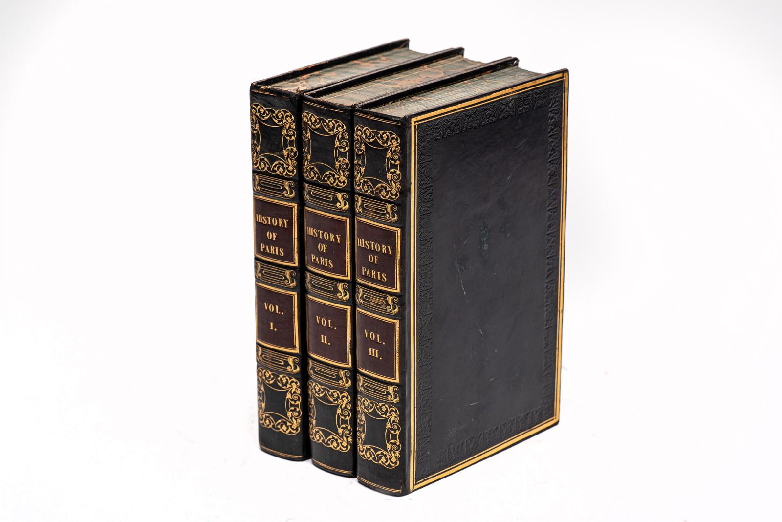 3 Volumes. (Various) History of Paris. Bound in 3/4 blue calf with the covers displaying open and gilt-tooling. The raised band spines display gilt-tooling with wine morocco labels. All of the edges are marbled with marbled endpapers. Includes