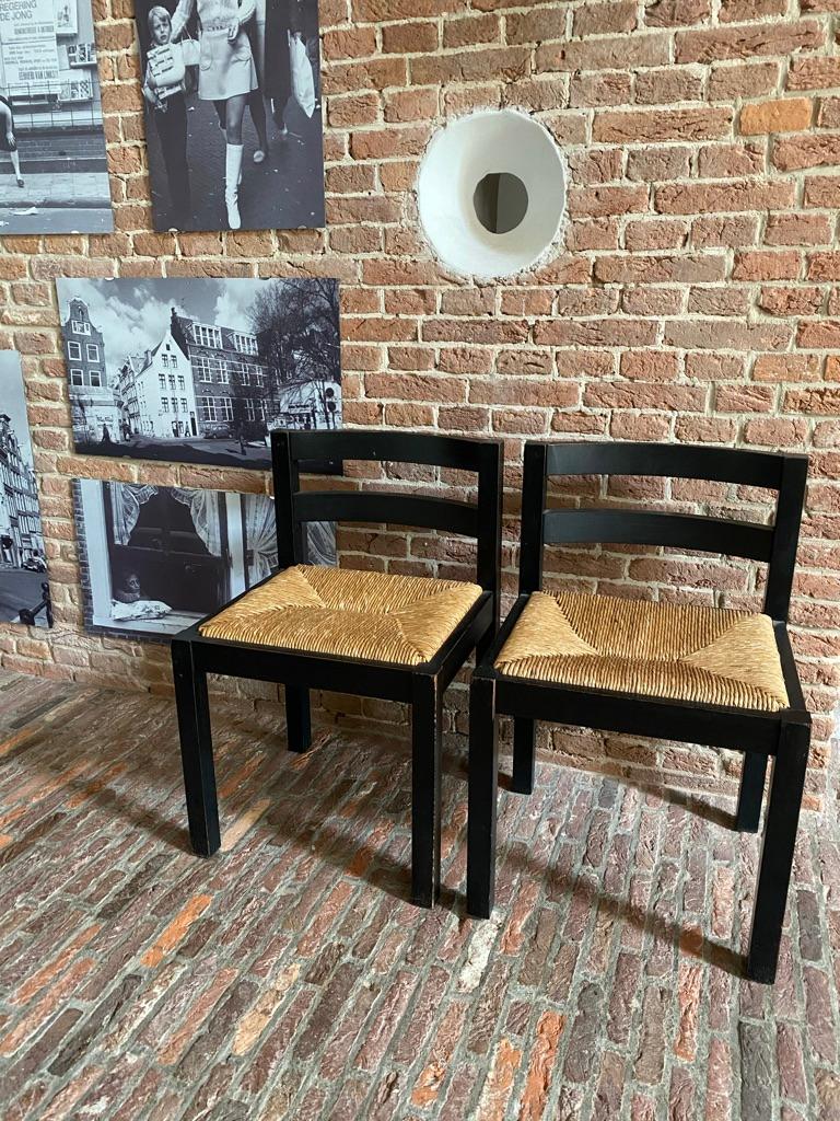 Set of 3 Martin Visser wengé framed dining chairs with rush (rattan like) seats. Beautiful set with double curved back rests. Netherlands 1960s. This set came from the Rotterdam Library (the stickers are still under the chairs) A modest design with