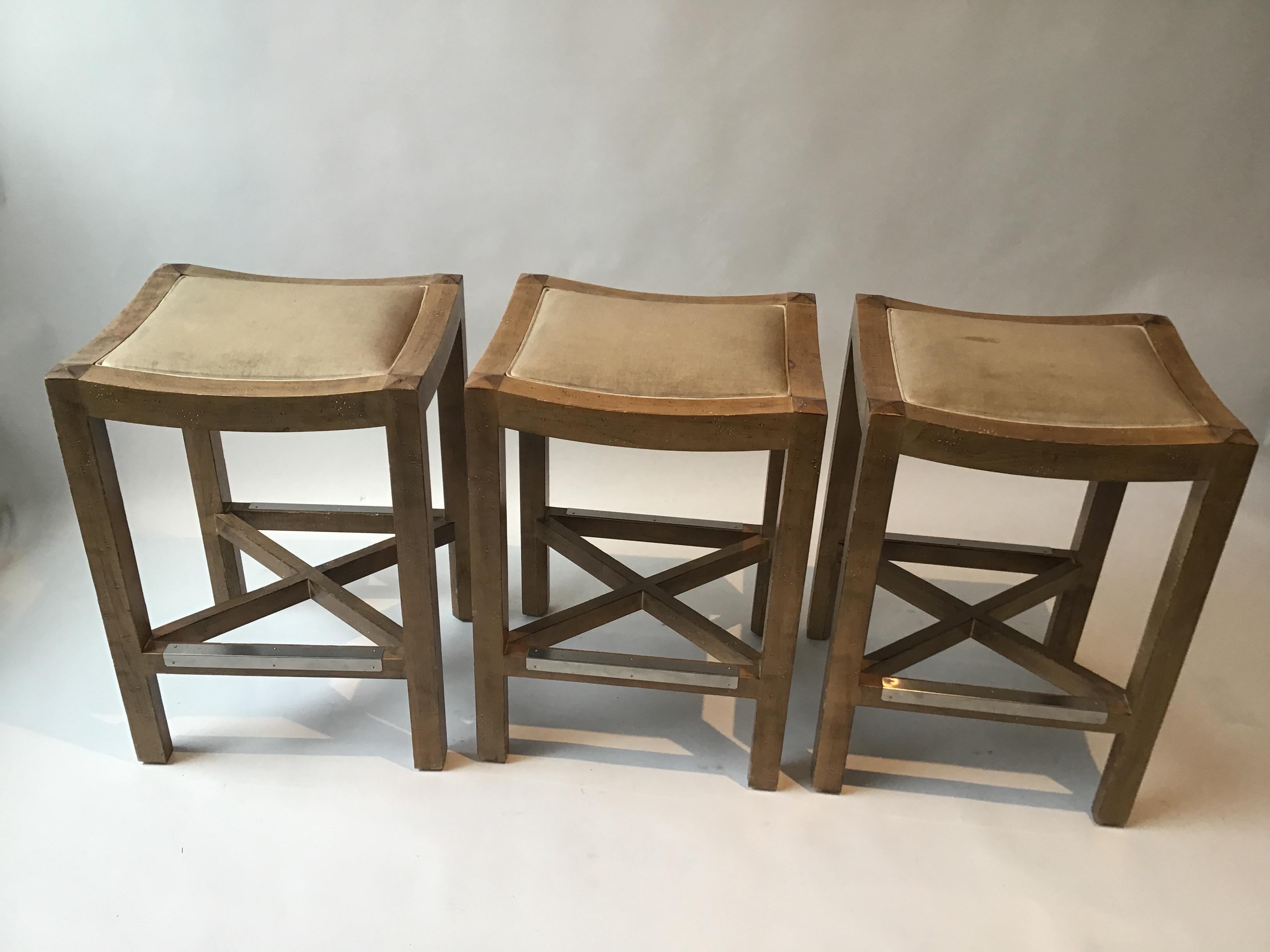 3 wood counter stools by Lee Industries. Some stains on fabric. Measures: 25.5” high.