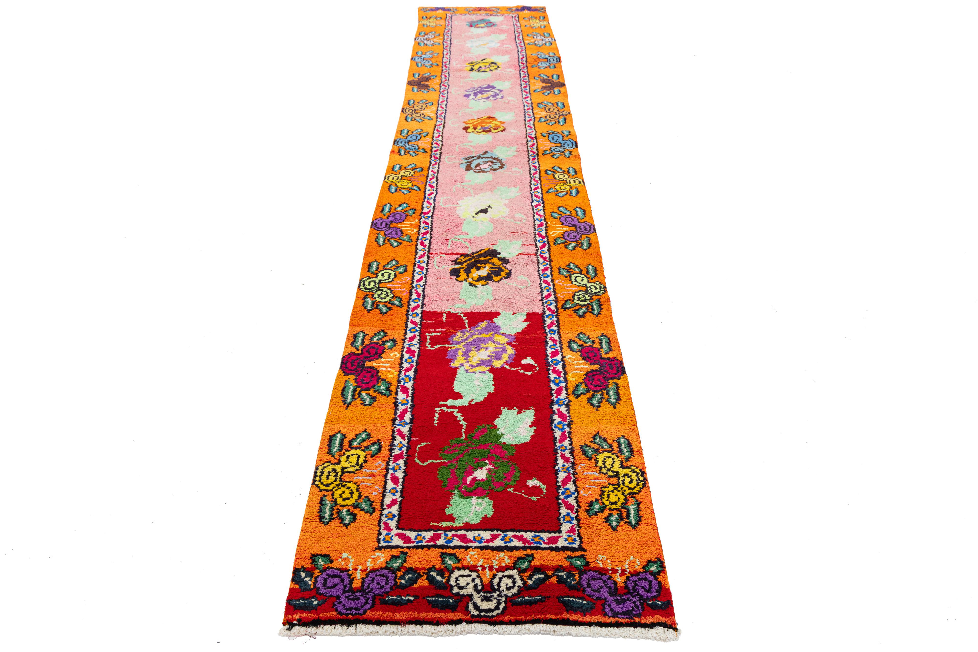 Handwoven in Turkey, this vintage runner features a vivid gradient field and richly detailed floral patterns. Inspired by traditional Anatolian artistry, its bold colors and symmetrical design offer a fresh, modern twist—perfect for collectors and