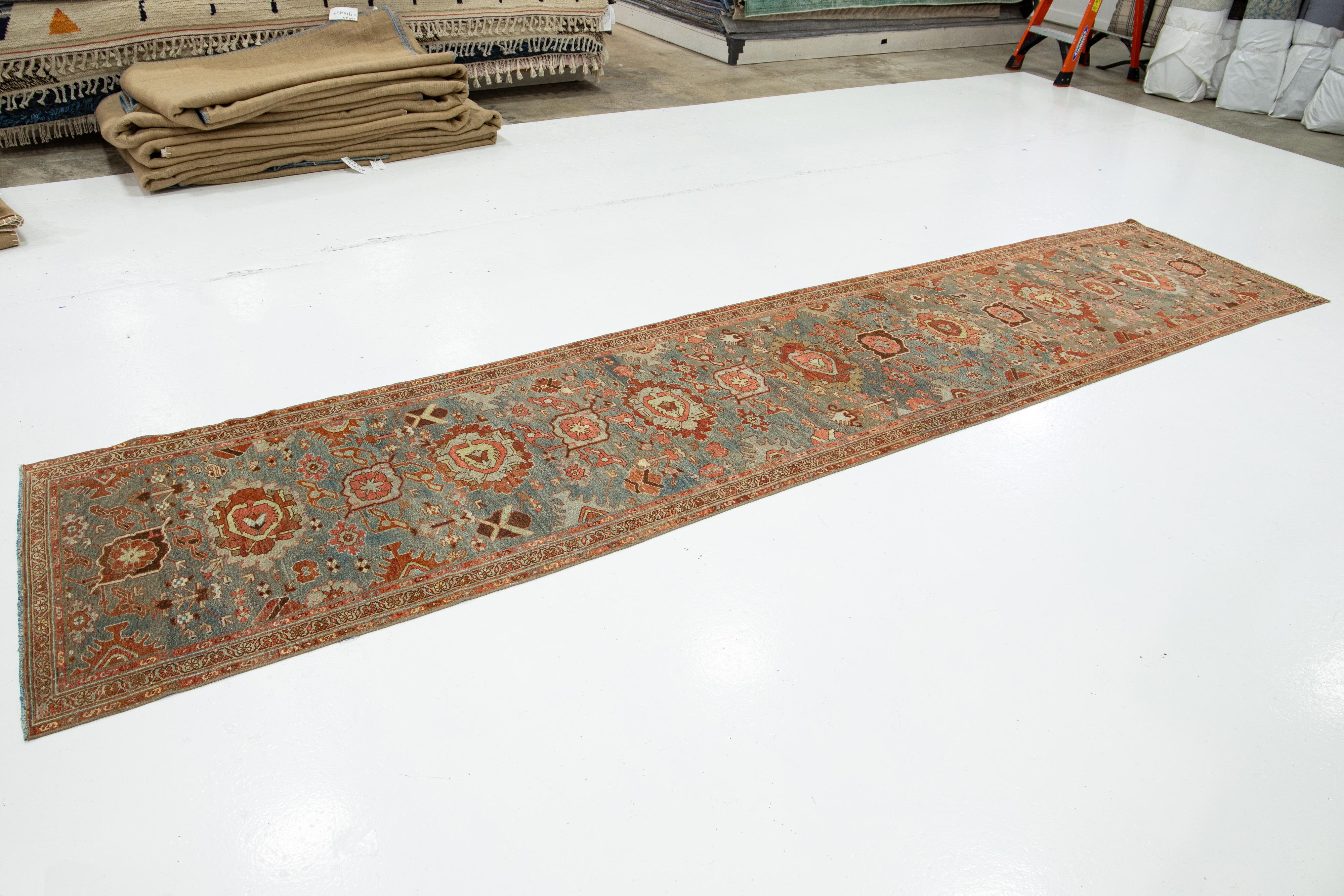 Persian 3 x 14 Antique Handmade Heriz Wool Runner In Blue With Floral Design For Sale