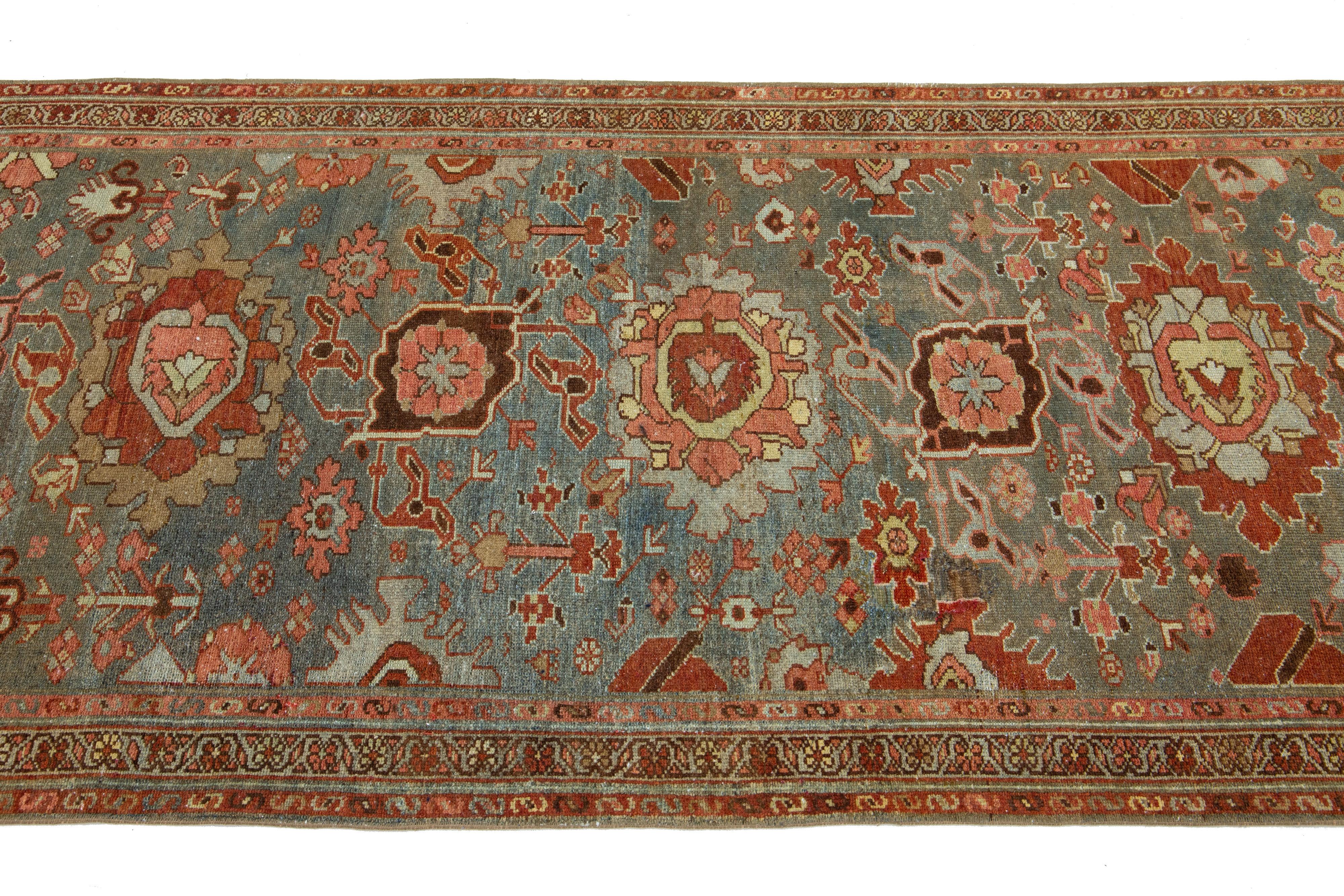 20th Century 3 x 14 Antique Handmade Heriz Wool Runner In Blue With Floral Design For Sale