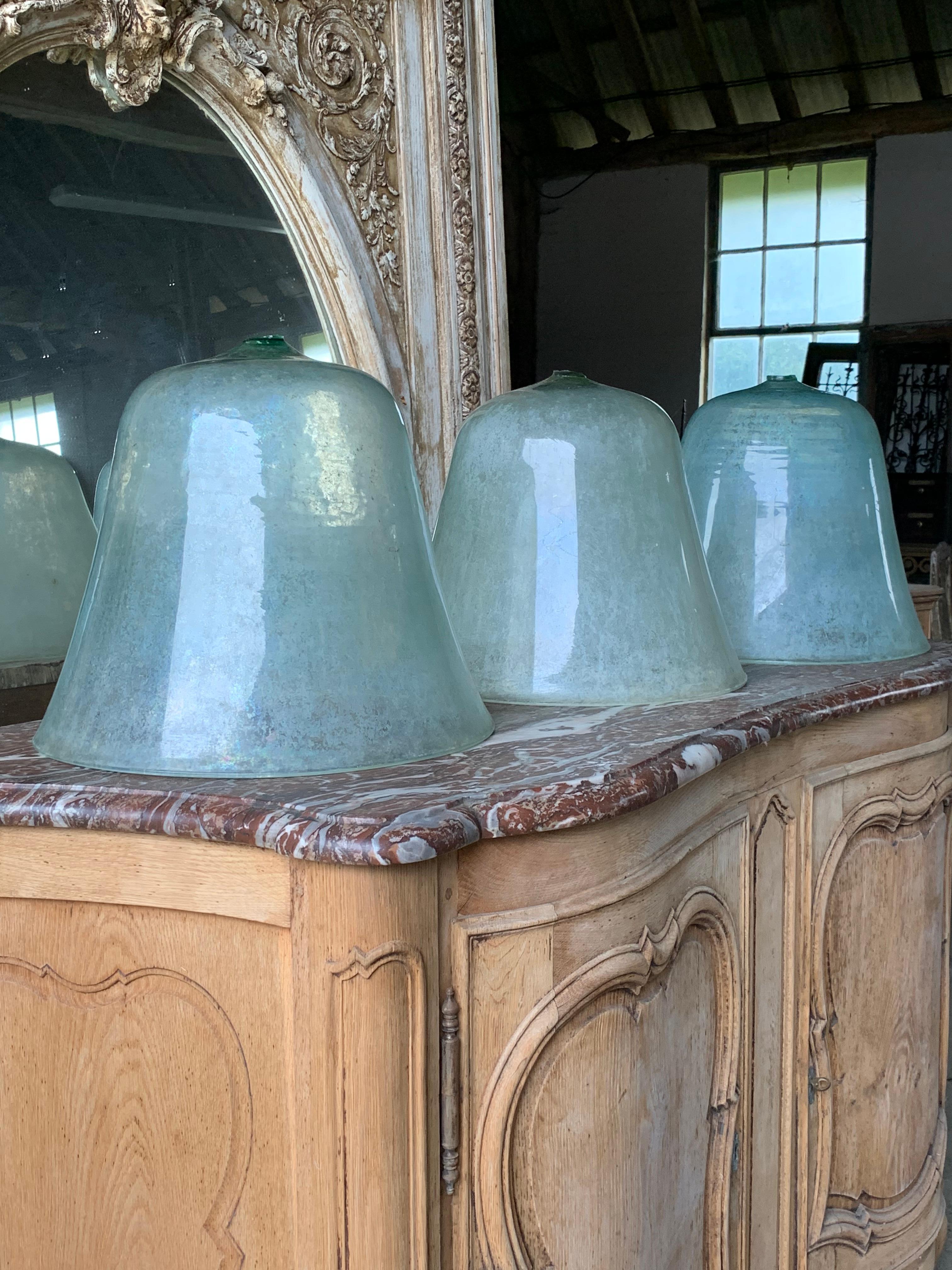 A nice set of 3 x 19th century French hand blown glass melon cloches. In nice original condition. The handles have been removed which was normal for the period as the handles magnified the sun so they removed them to stop this.

Please contact us