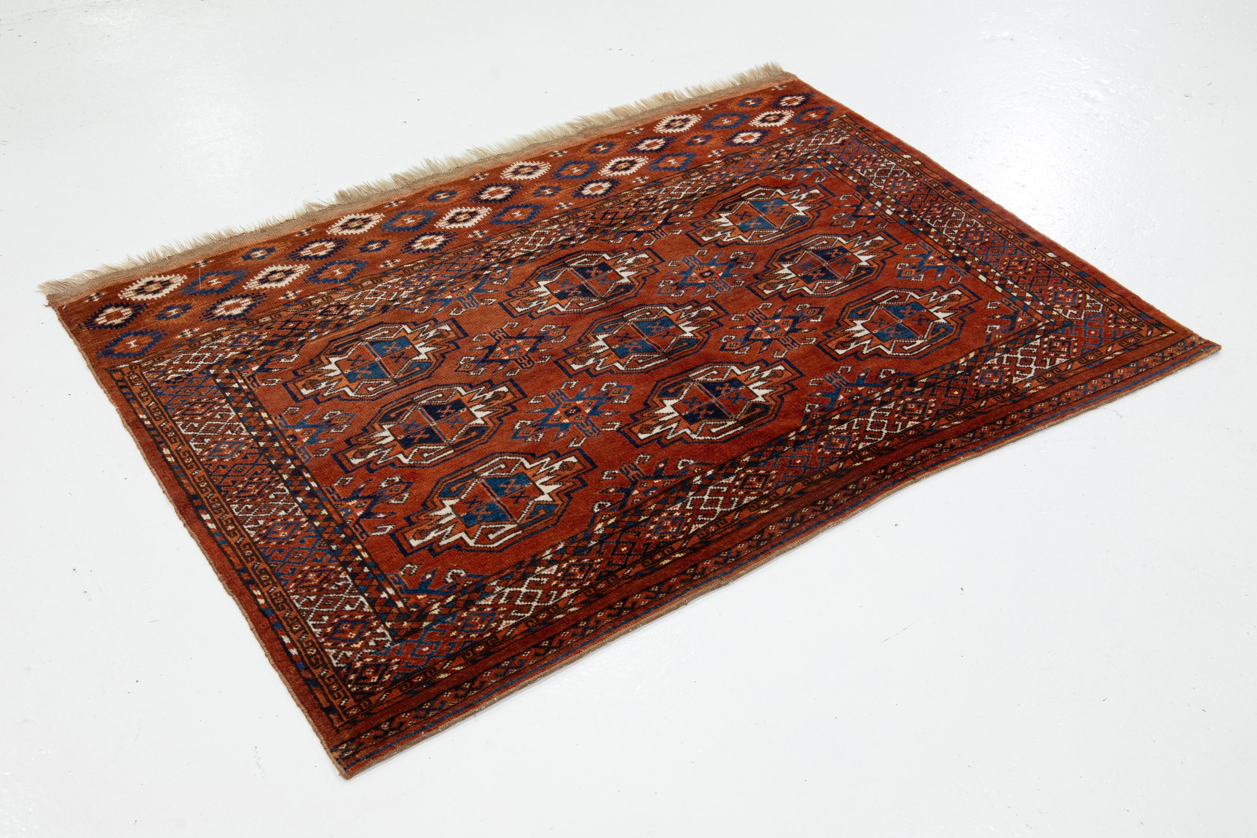 Islamic 3 x 5 Antique Persian Turkmen Wool Rug In Rust Color With Allover Gul Pattern For Sale
