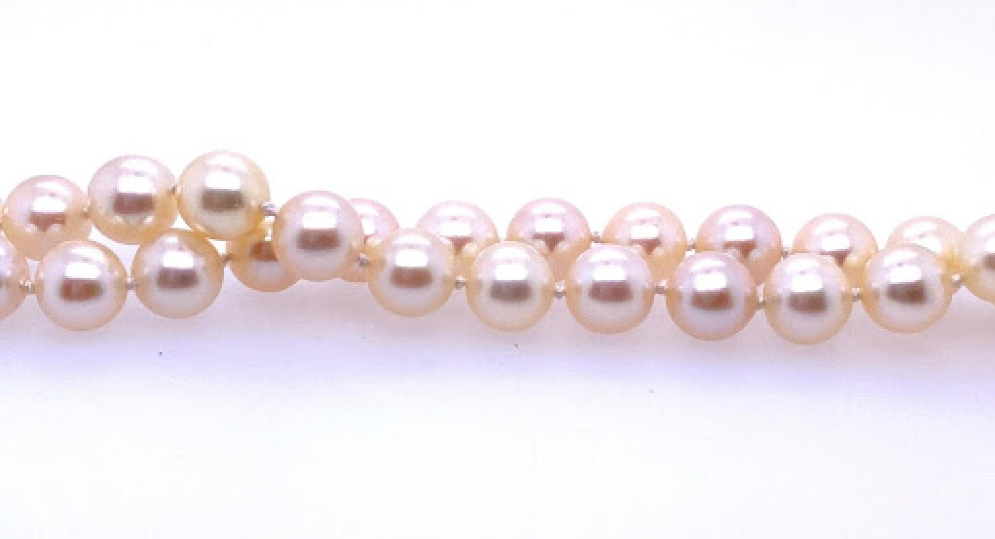 30’’ pearl strand, featuring 7.5 mm cultured akoya pearls, totaling 91 pearls. Necklace has a 14 karat yellow gold ( stamped 14K) barrel clasp that measures 8mm long by 5.5mm wide. 