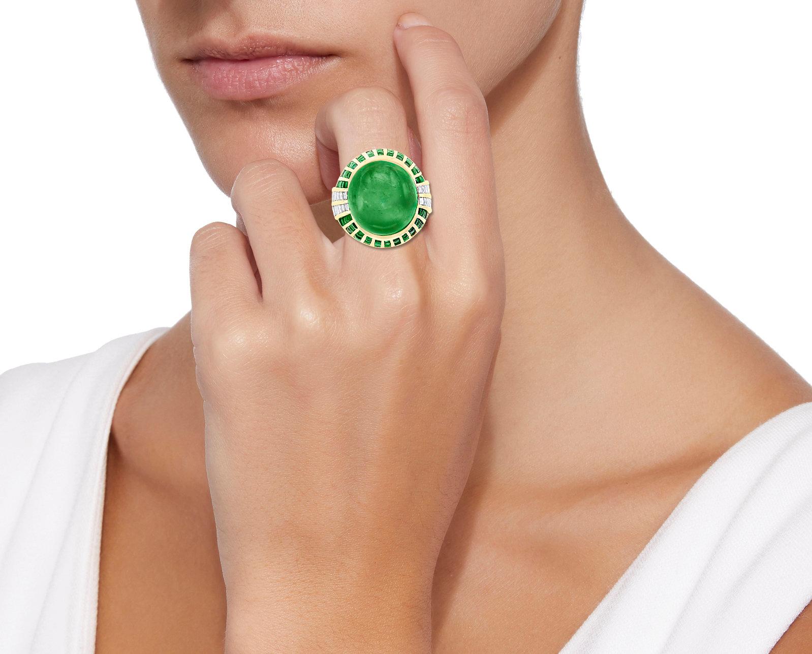 A classic, Cocktail ring 
Large size Colombian cabochon approximately 30 Carat Emerald and Diamond Ring, Estate with no color enhancement. Picture do not do the justification with the color and luster of the emerald.
Gold: 18 carat Yellow gold