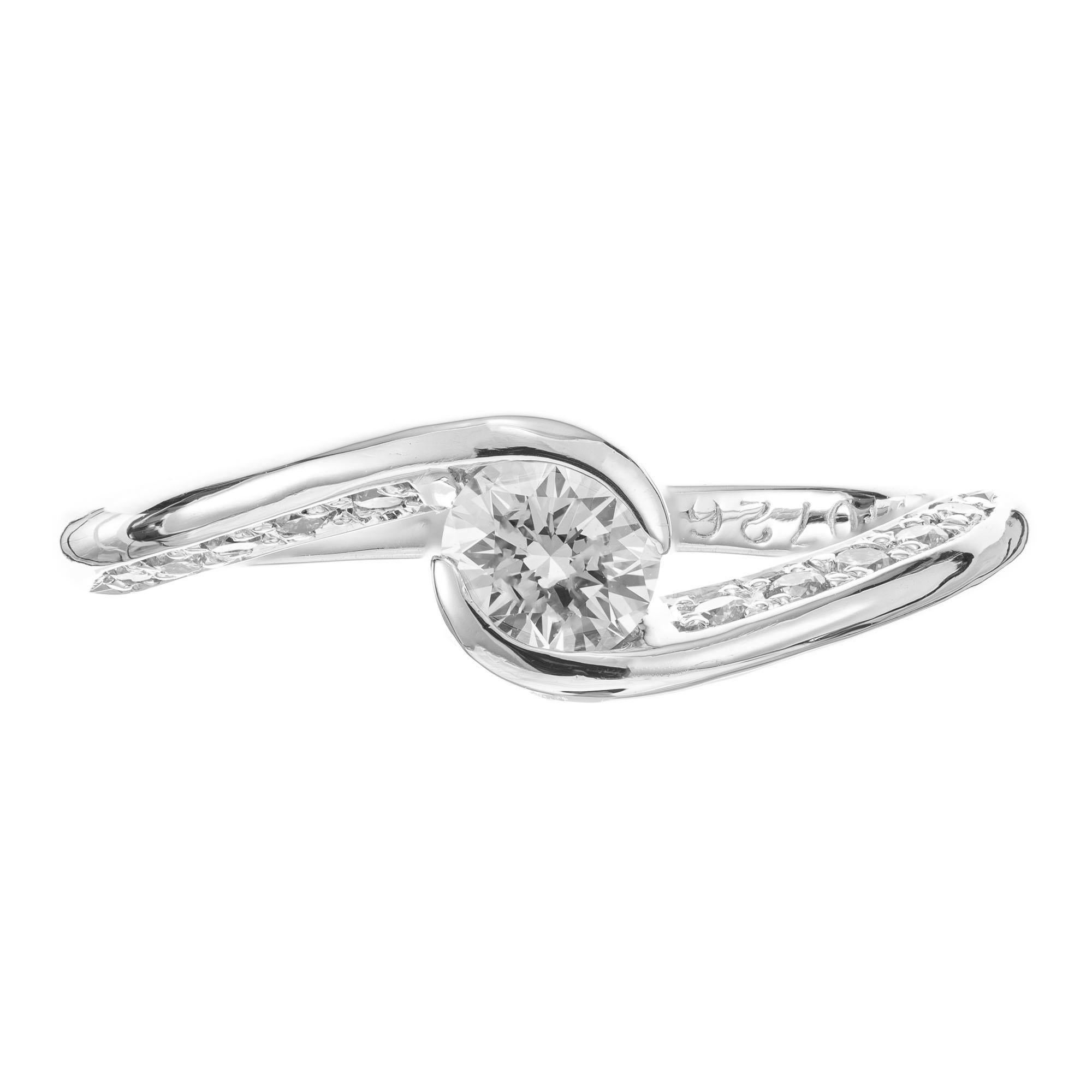 Diamond Swirl design Platinum engagement ring. .30ct full cut center stone with 19 Ideal full cut accent diamonds. There are multiple stamps in the shank, we do not know the designer.  

1 full cut diamond, approx. total weight .30cts, F, VS 
19