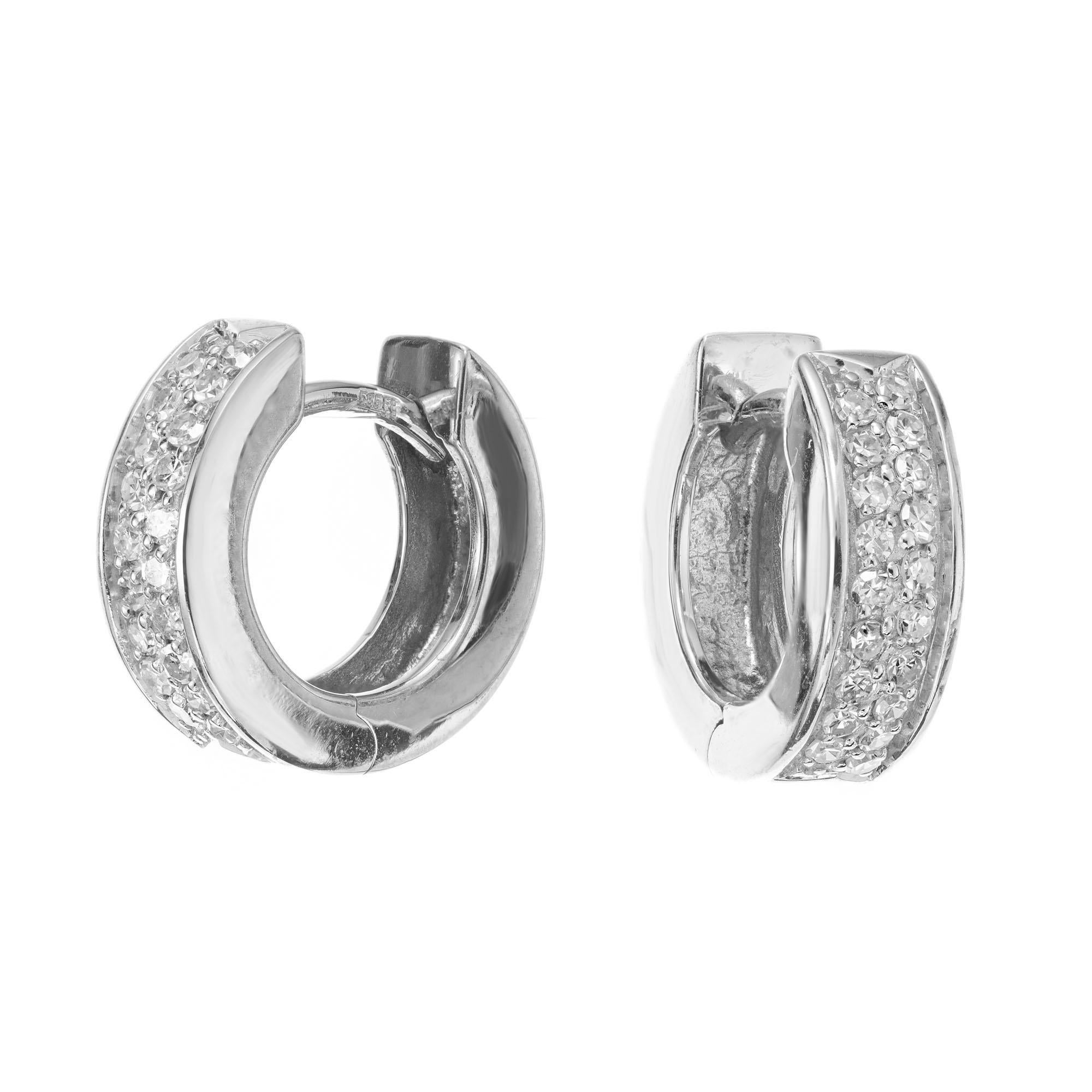 Diamond huggie hoop earrings. 38 single cut round diamonds set in 14k white gold settings. 4mm wide

38 single cut diamonds, H-I VS approx. .30cts
14k white gold 
Stamped: 585
4.1 grams
Top to bottom: 12.6mm or .5 Inch
Width: 4.0mm or 3/16