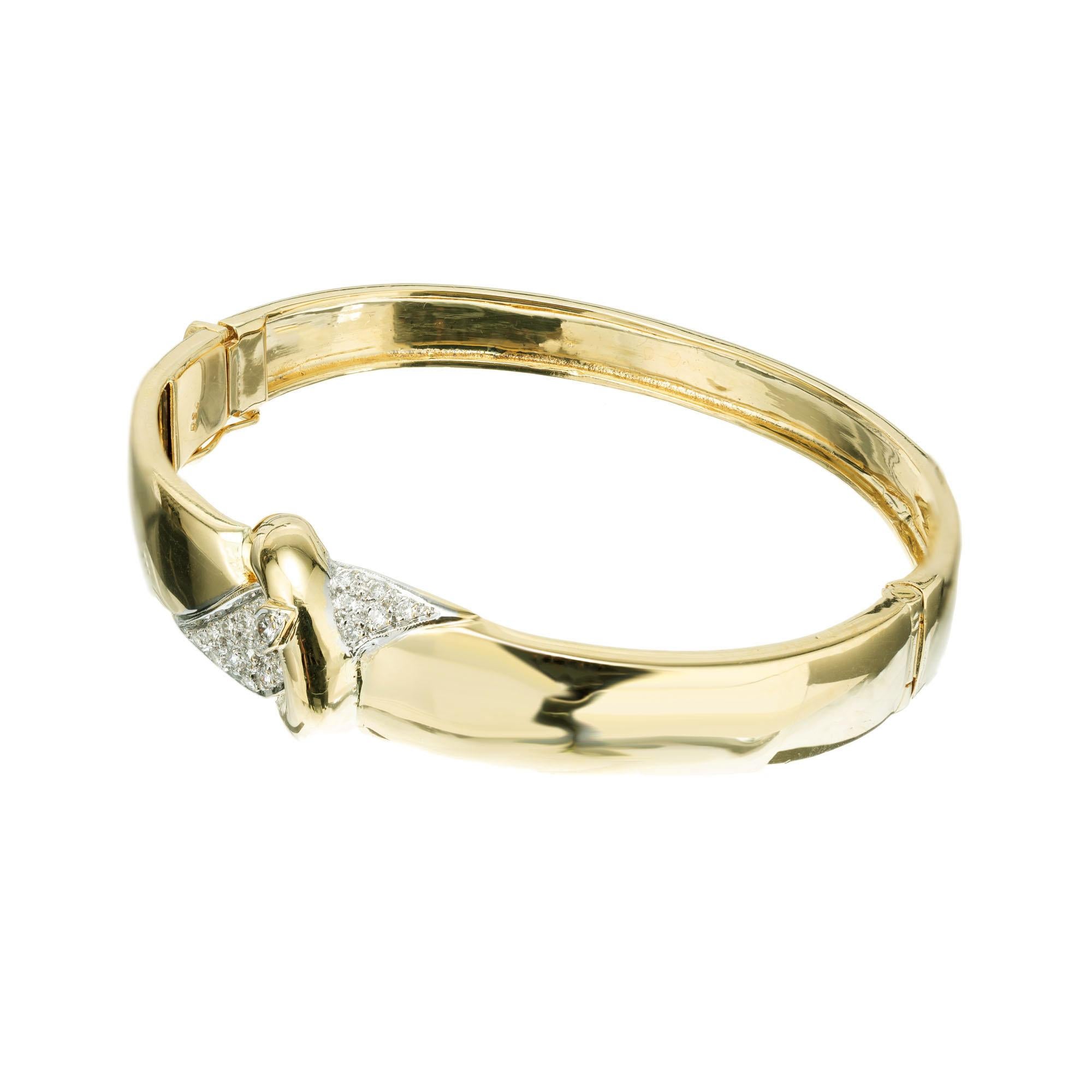 Diamond bangle bracelet. 18k yellow gold hinged bracelet with a buckle design set with 20 round brilliant cut pave diamonds. Built in catch and side lock safety. Fits a 7 to 7.5 Inch wrist.

20 round brilliant cut diamonds, G VS approx. .30cts
18k