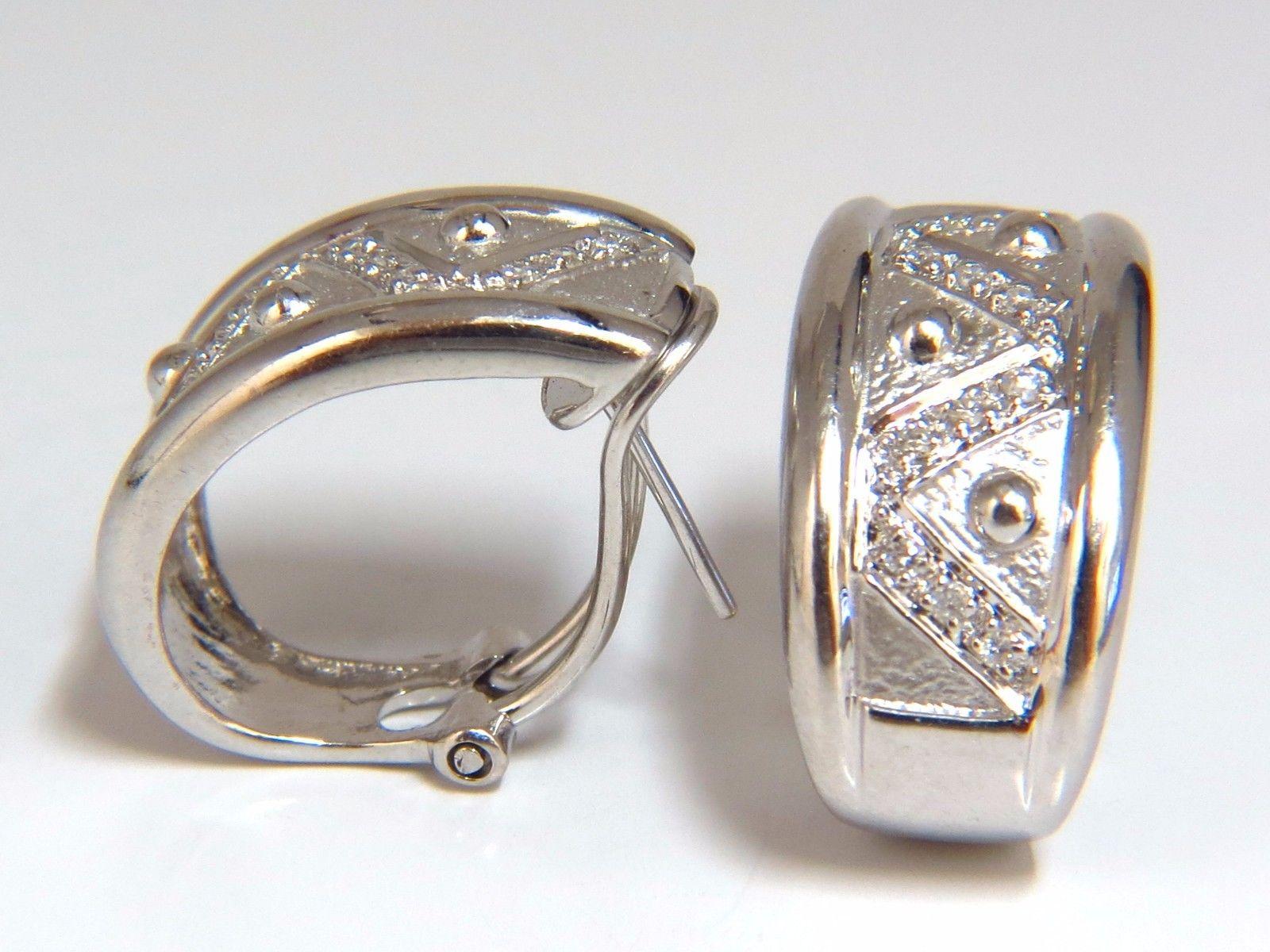 Diamond Semi Hoop / Mid Huggie

Earring Clips

.30ct. Natural Diamonds: 
Rounds, full cuts

G-color, Vs-2 clarity

9.5 grams

18Kt. white gold.

Overall:

 .86 inch long

.42 inch wide

.63 inch front to back


Comfortable omega clip