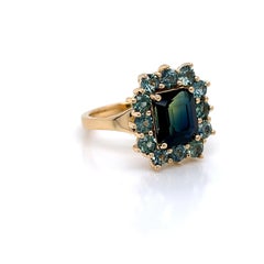 3.0 Carat Emerald cut Teal Sapphire Ring set in 18K Yellow Gold