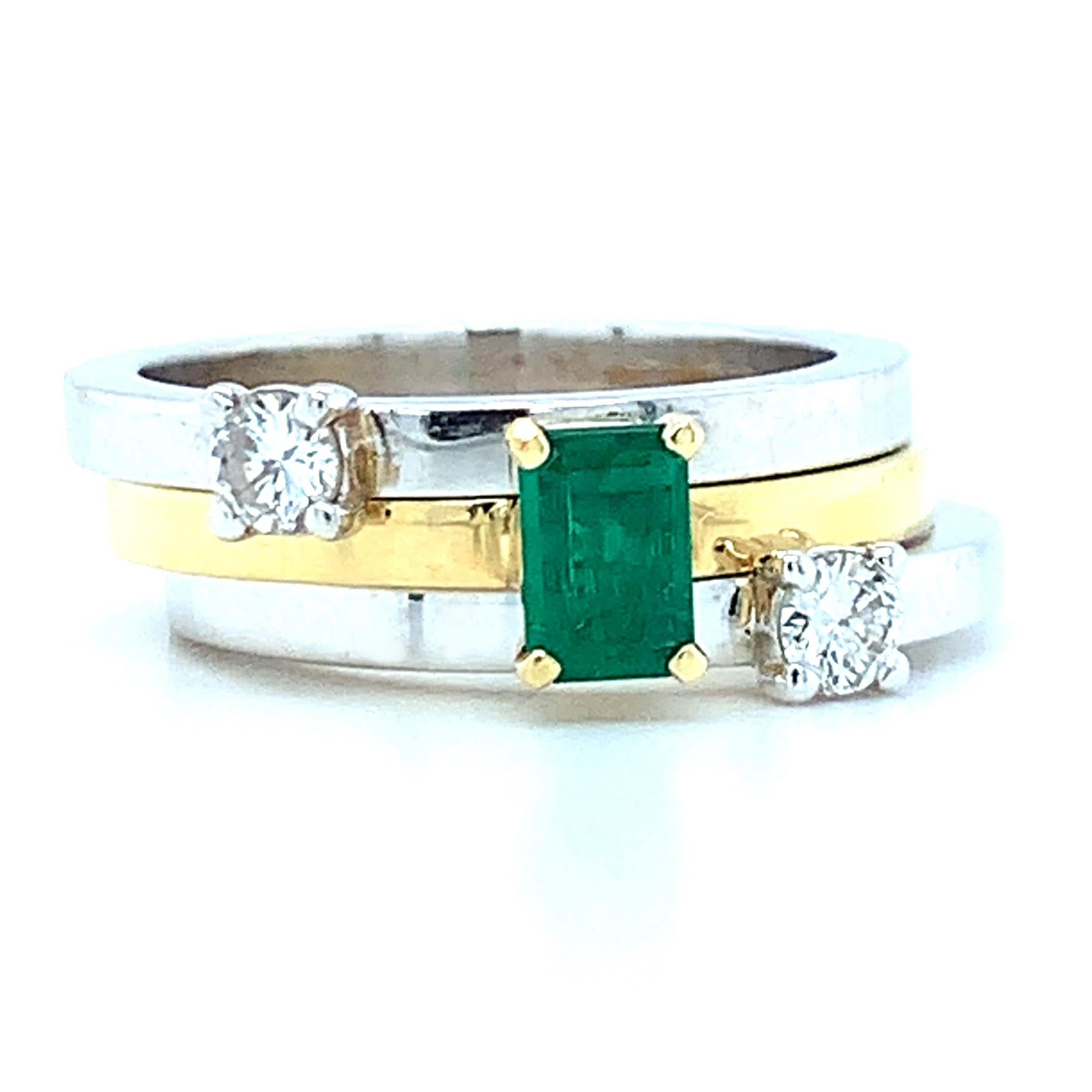 This set of three stacking rings features a timeless combination of emerald and diamonds, yet is so contemporary and stylish! The emerald has rich green color and is set on a beautifully high polished band of 18k yellow gold. The princess cut