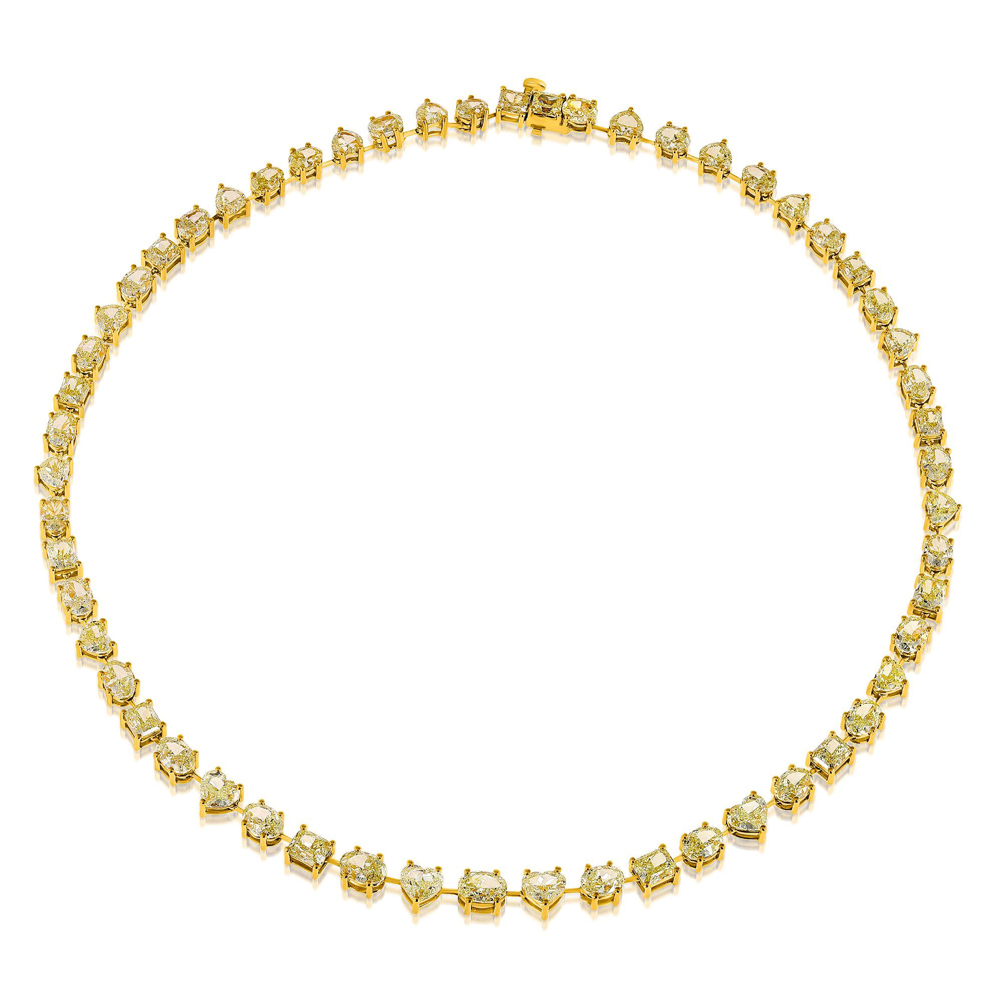 Introducing our extraordinary Mix-Shaped Cut Yellow Diamond tennis necklace, showcasing a stunning array of 56 yellow diamonds in heart-shaped, oval cut, and radiant shapes. These perfectly matched stones in color create a harmonious and captivating