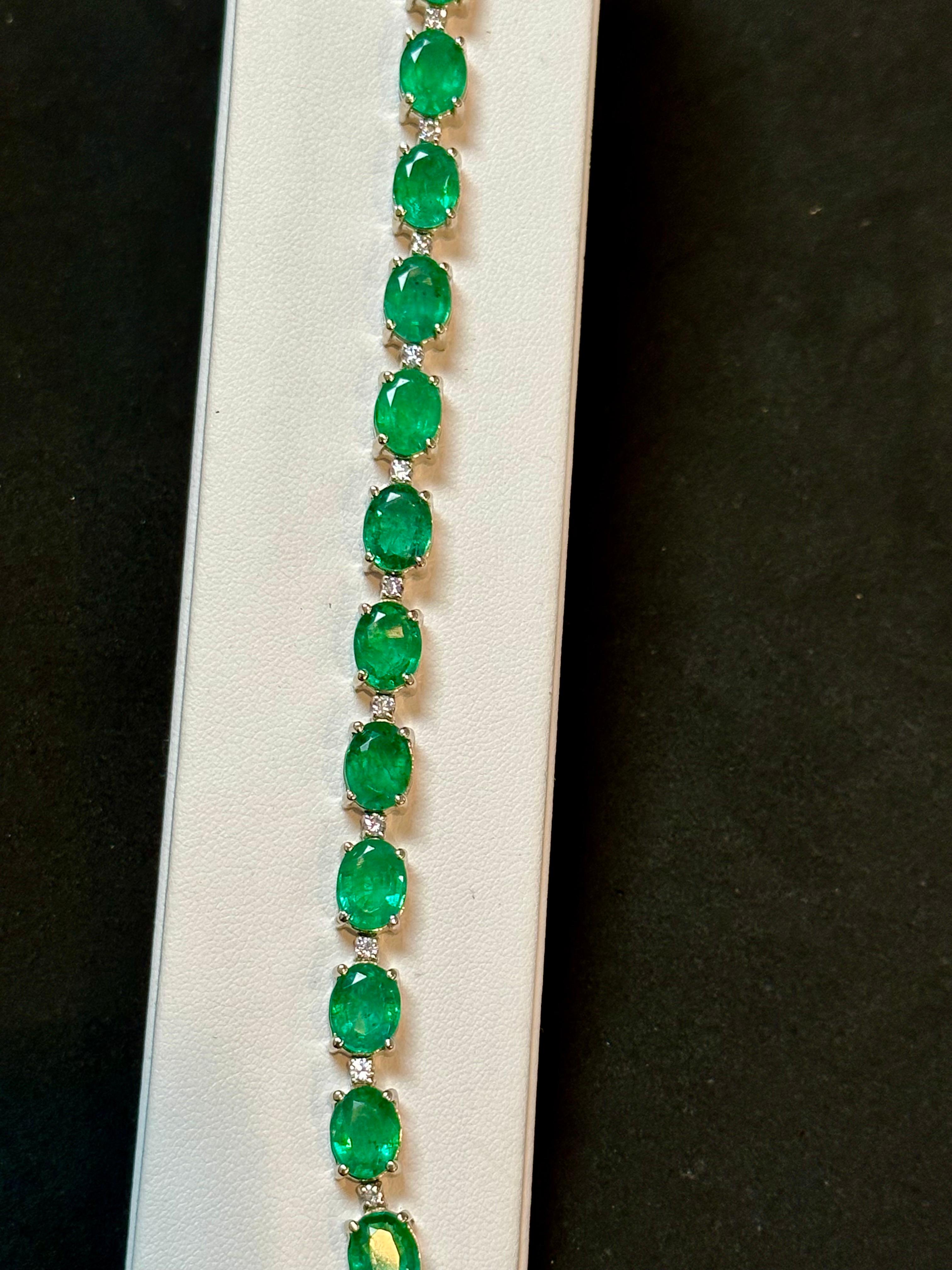 Introducing our remarkable 14 Karat Gold Tennis Bracelet adorned with approximately 30 carats of natural Zambian Emeralds and dazzling diamonds. This high-quality bracelet features 15 oval emeralds, carefully separated by brilliant-cut diamonds. The
