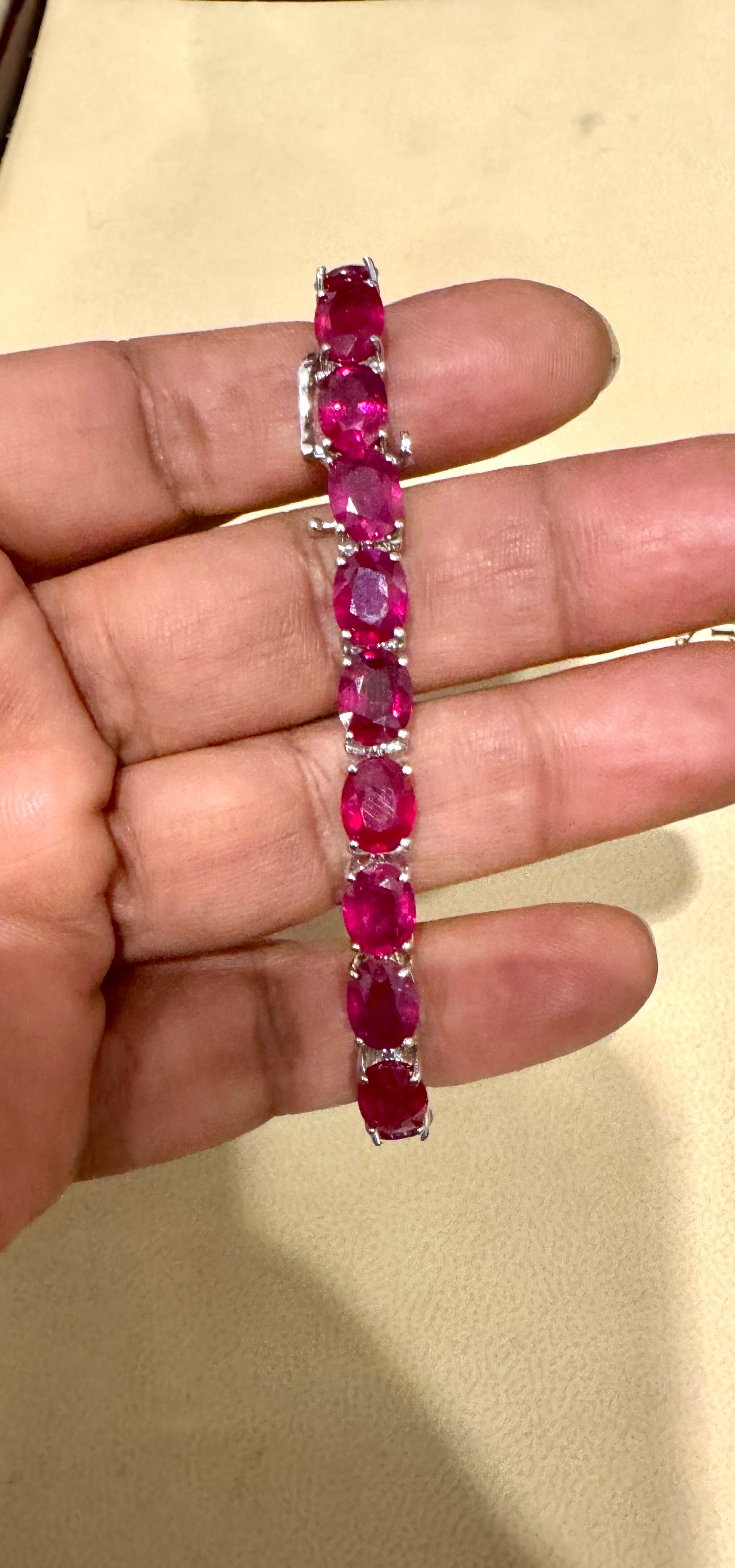 This exceptionally affordable Tennis bracelet has 21 stones of oval Treated Rubies . 
Ruby is Treated. The weight of the Ruby is approximately 30 Carat , Each ruby is approximately 1.5  ct , measuring 5X7 MM

Standard 7 inch long.
The bracelet is