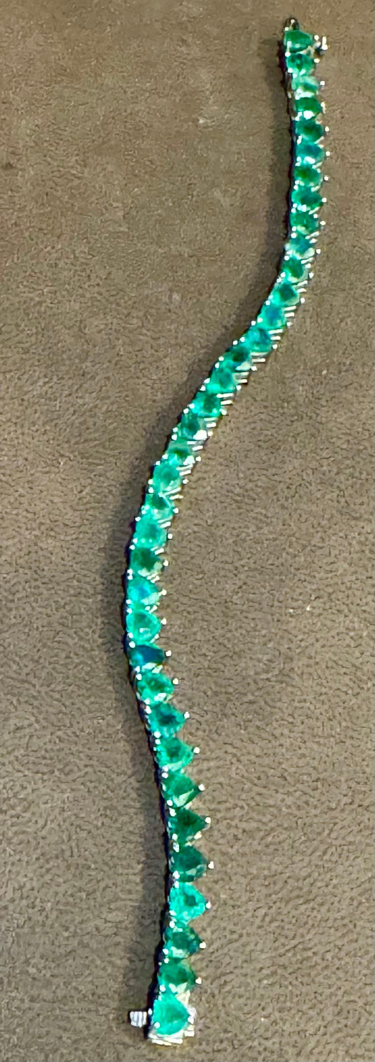 This exceptionally Beautiful Tennis  bracelet has 36 stones of Heart shape  Emeralds  .  Total weight of the Emeralds is  approximately 30 carat. 
The bracelet is expertly crafted with 15.6  grams of  14 karat White  gold .including the stones.