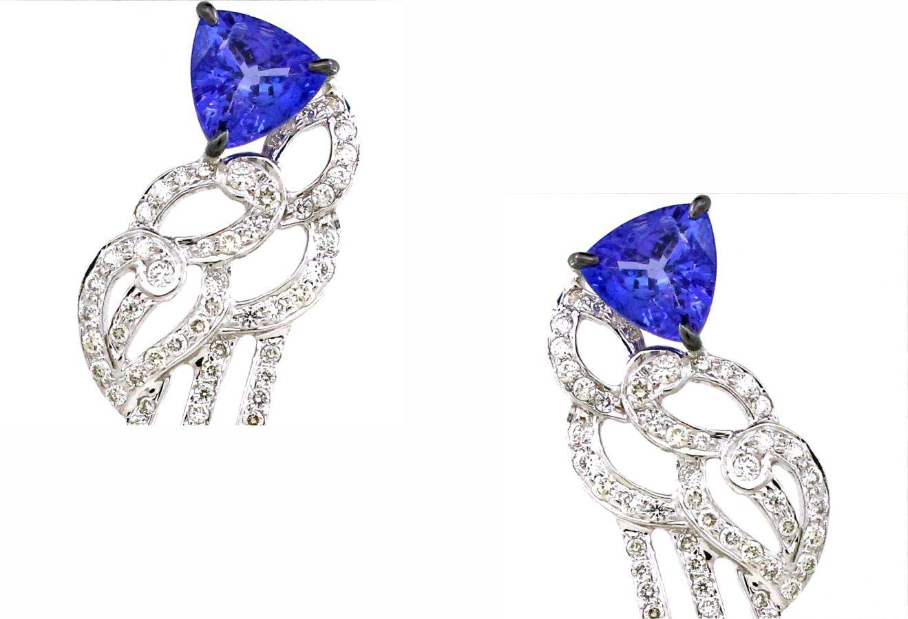 Experience the epitome of luxury with these breathtaking drop earrings, designed to dazzle with their intricate and vibrant details. Each earring features 252 round-shaped white diamonds, totaling 3.57 carats, creating a radiant and sparkling