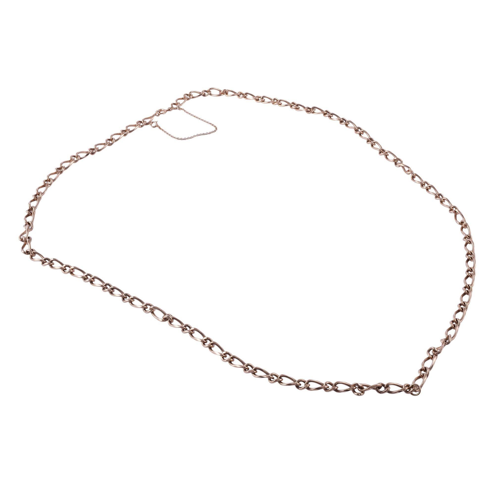 Antique 30 inch 14K gold chain figaro necklace, circa 1900. This chain necklace is crafted in 14 karat yellow gold in a wide figaro link style. The figaro chain features a safety chain, a spring ring clasp, and a loop for hanging. [KIMH