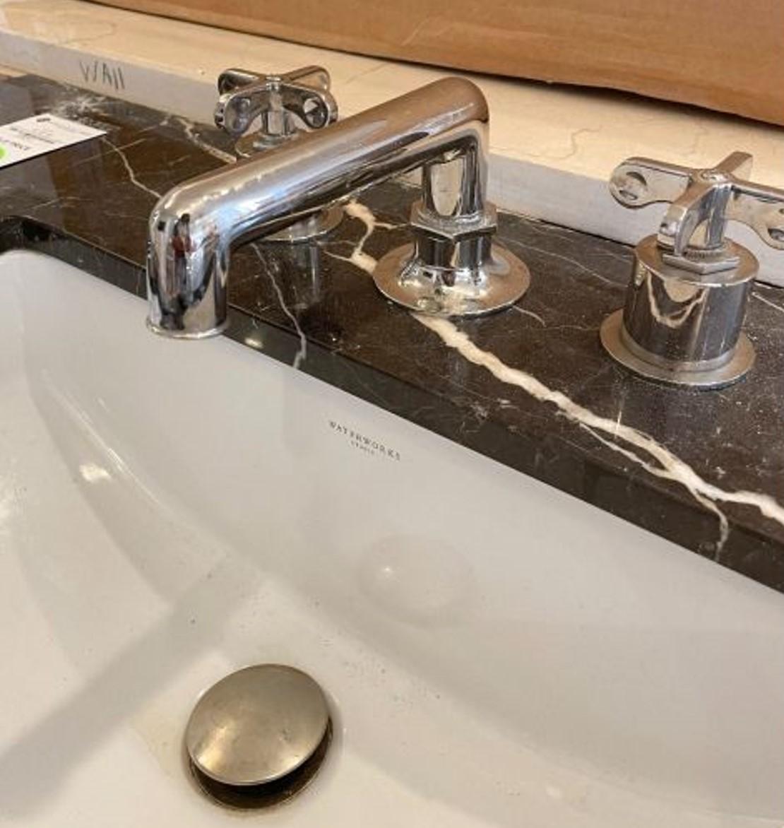 Custom made sink vanity made for 212 Fifth Avenue (Jeff Bezos home). 
Completely clad in Nero Marquino marble. Waterworks sink. 
Faucet not included but can be supplied upon request. 
30” wide with a single drawer. 