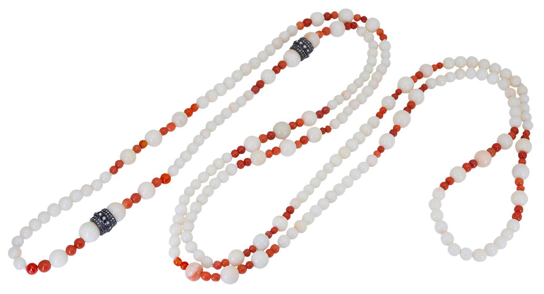 These White and Red Coral beads were purchased as part of an estate before being made into this beautiful 30 inch necklace that consists of round white 5.5 - 9.0 mm coral beads and vivid 4 mm red coral beads that create a stunning contrast that is