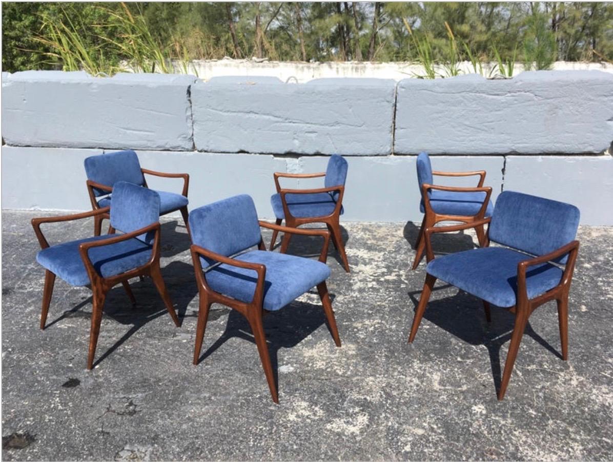 30 Custom sculptural dining chairs in the style of Gio Ponti. Solid walnut, maple, oak  or mahogany frames, fabric backs and seats. Arm height is 25.25”. Available seat height is 17”5 - 19”. Made in the USA.
Customer provides fabric.