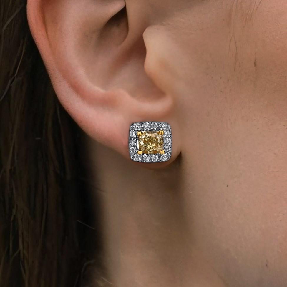 Crafted in 14K Yellow Gold, these stunning earrings feature both full cut diamonds and yellow diamonds. With a total diamond weight of 0.70 CT, they offer exceptional sparkle and brilliance. The earrings weigh 1.85 grams and are perfect for adding