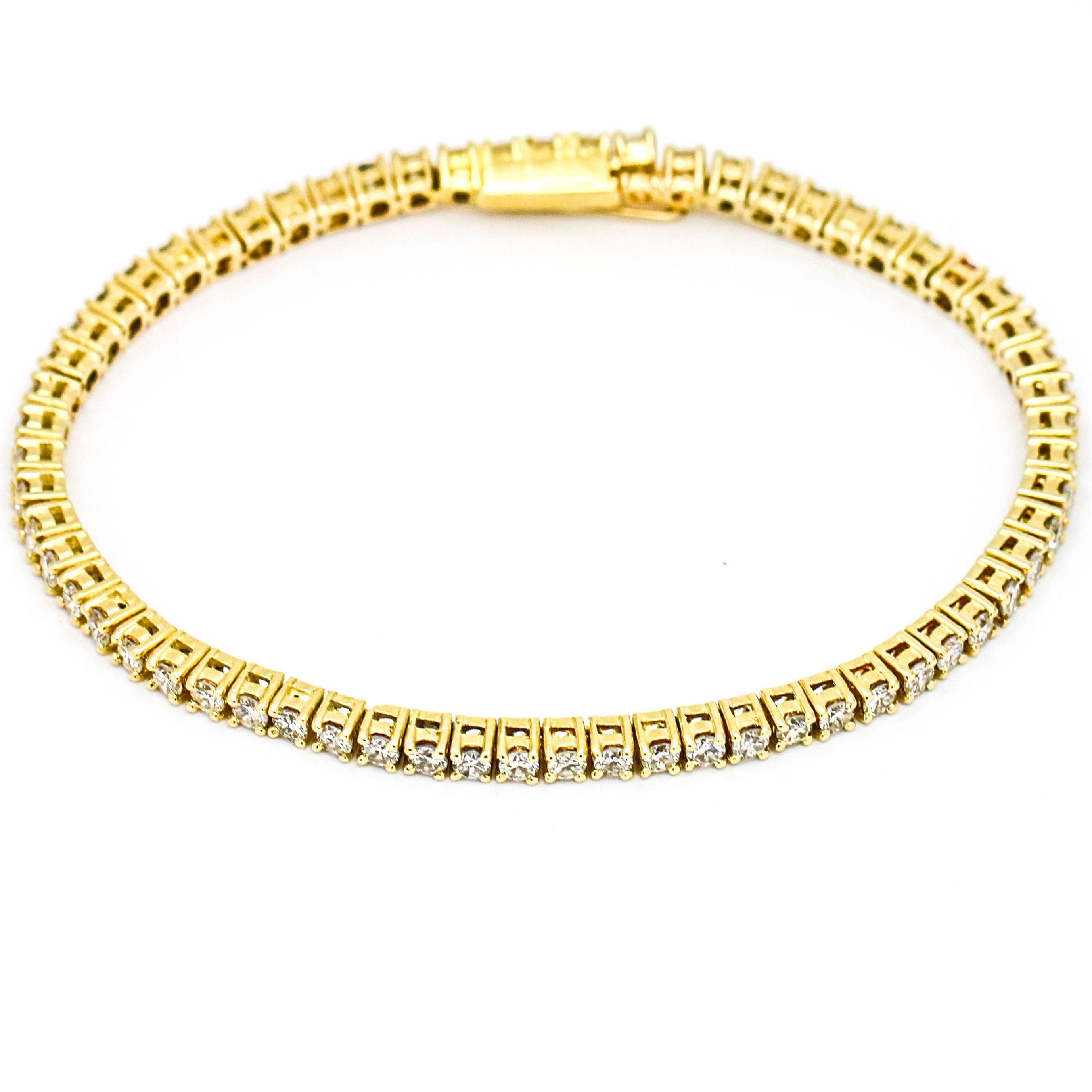 Diamond tennis bracelet crafted in 14-karat yellow gold. Slide clasp with safety.

Size, Medium
Length, 7 inches
Width, 2.5mm
Weight, 11.3 grams
Total carat weight, 3.00 carats

Previously owned, in excellent condition. Cleaned and polished. It