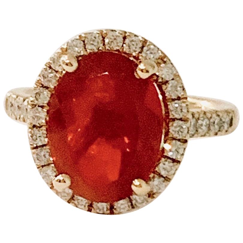 3.00 Carat AAA Oval Fire Opal Set in Diamond Halo Ring in 18 Carat Yellow Gold For Sale