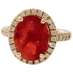 3.00 Carat AAA Oval Fire Opal Set in Diamond Halo Ring in 18 Carat Yellow Gold