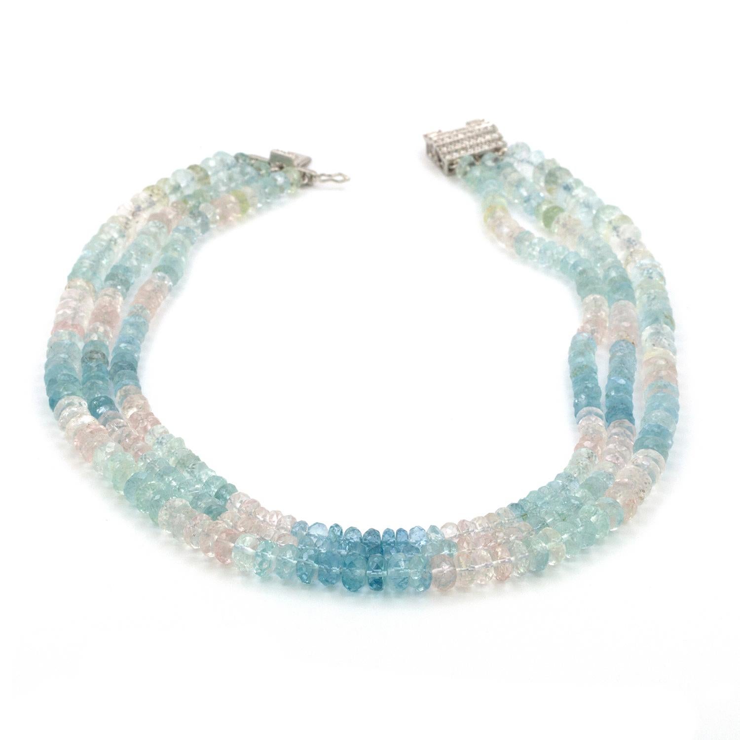 A 300 carat Aquamarine and Pink Topaz 3 strand necklace that is comprised of 5.50 - 7.75 mm briolette cut Aquamarine and Pink Topaz, connected with a 18k white gold, diamond clasp that contains 40 rbc diamonds that weigh approximately 1 ct and