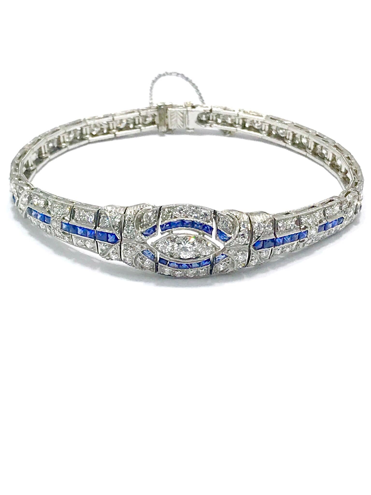 This is an absolutely gorgeous Art Deco diamond and sapphire platinum bracelet.  The bracelet contains 97 round diamonds for a total weight of 3.00 carats, accented by channel set french cut sapphires in hand crafted filigree beaded edge platinum. 