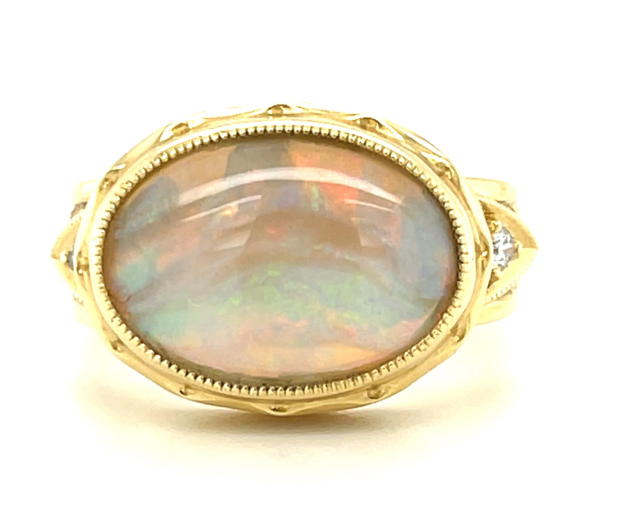 If you love rainbows, you'll love this gorgeous opal ring! The Australian opal featured in this ring weighs exactly 3 carats and displays gorgeous play-of-color in lively bands and brilliant flashes that dance throughout this phenomenal gemstone.