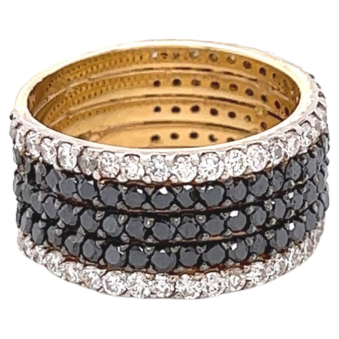 This Black and White Diamond Band is stunning and versatile! Can be worn as a wedding or engagment band or as a gorgeous cocktail ring or an everyday stunner! 

There are 90 Black Round Cut Diamonds that weigh 1.80 Carats and 60 Round Cut Diamonds