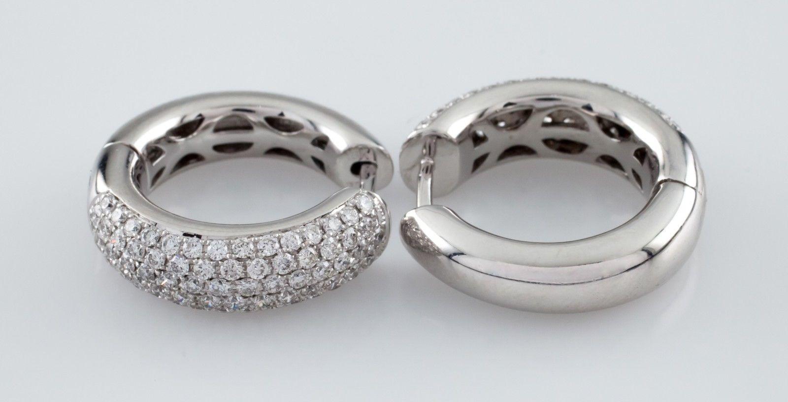 Gorgeous 18k White Gold Hoop Earrings
Feature Round Cut Pave Set Diamonds on Half of Each Domed Hoop
Total Diamond Weight = Approximately 3 carats
Average Color: G
Average Clarity: VS
Diameter of Hoop = 19 mm
Width of Hoop = 6 mm
Total Mass = 10.2