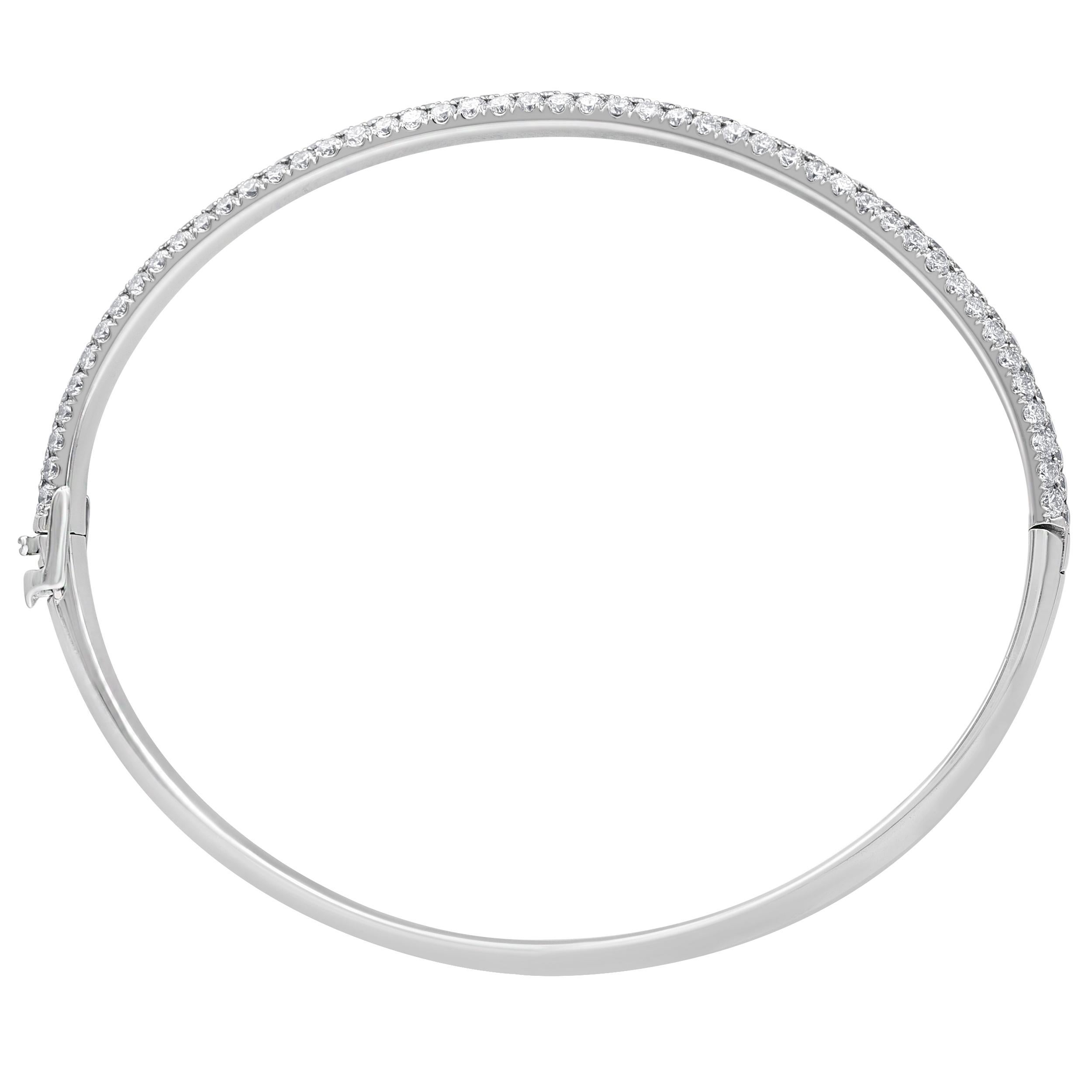 A classic style, this diamond bangle is a must-have for any jewelry collection. Created in cool 18K white gold, this choice sparkles with rows of diamonds along with the rounded band. Captivating with 3 cts of diamonds and a bright polished shine,