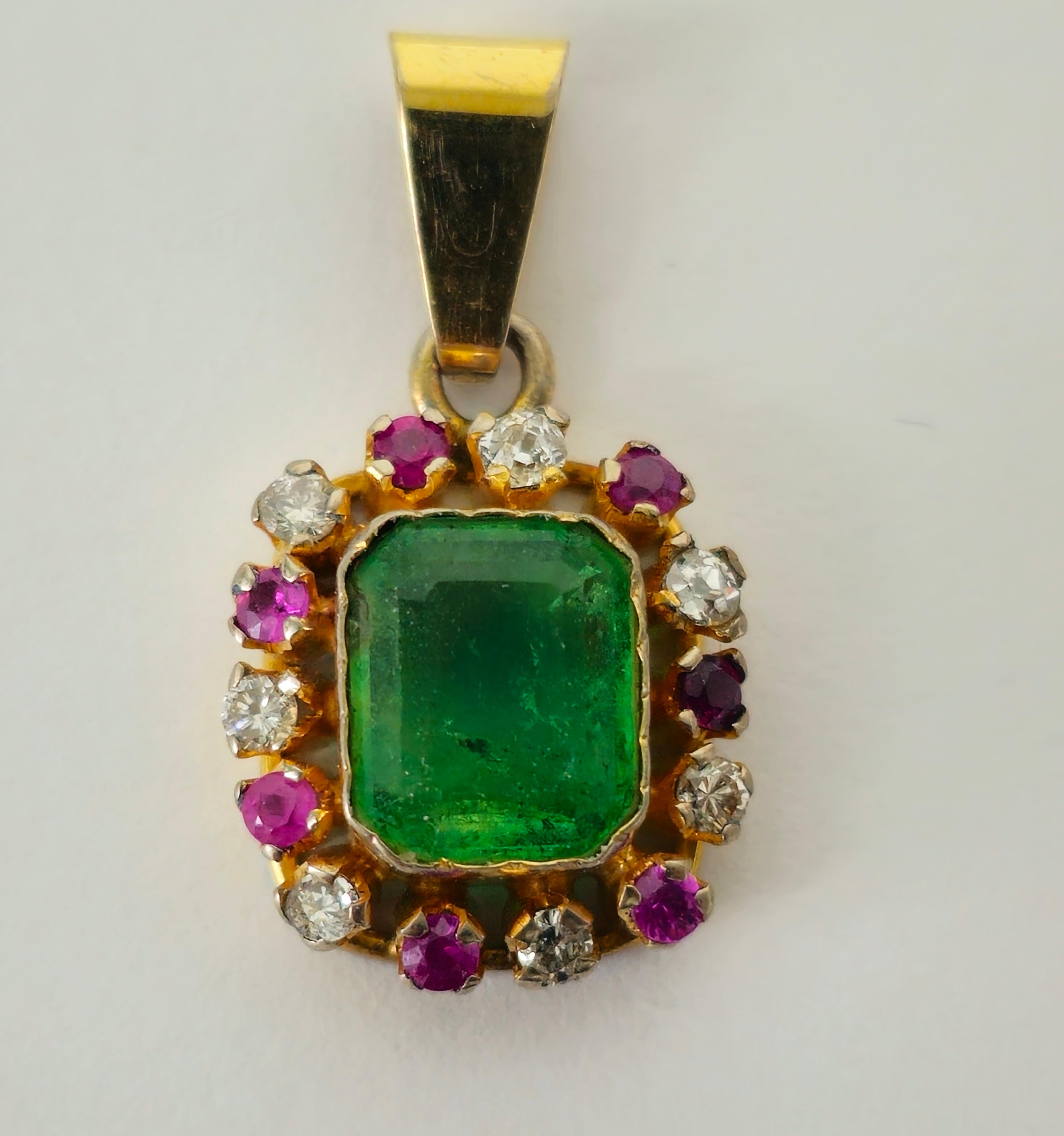 Fashioned from radiant 18K yellow gold, this exquisite pendant showcases a dazzling array of gemstones, including a 0.20 carat diamond, SI clarity, and G color, alongside a 0.30 carat Burma ruby and a striking 2.50 carat emerald. With a total carat