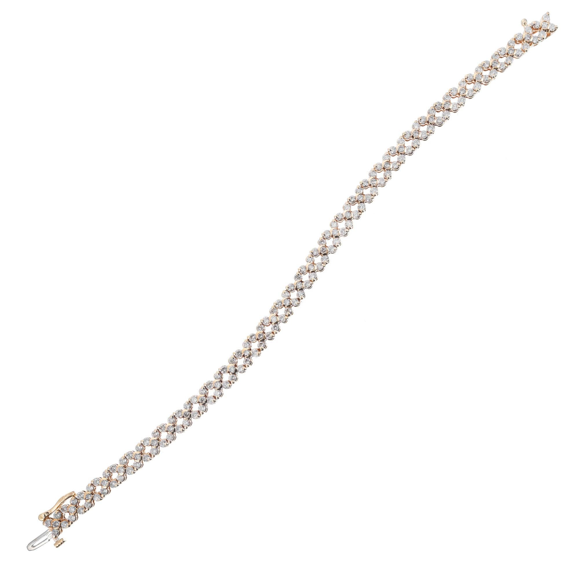 Diamond star yellow gold bracelet. 170 round diamonds set in a 14k yellow gold star design hinged link bracelet. Hidden built in catch and side lock safety. 7 inches in length. 

170 round diamonds, approx. total weight 3.00cts, H-I, SI
14k yellow
